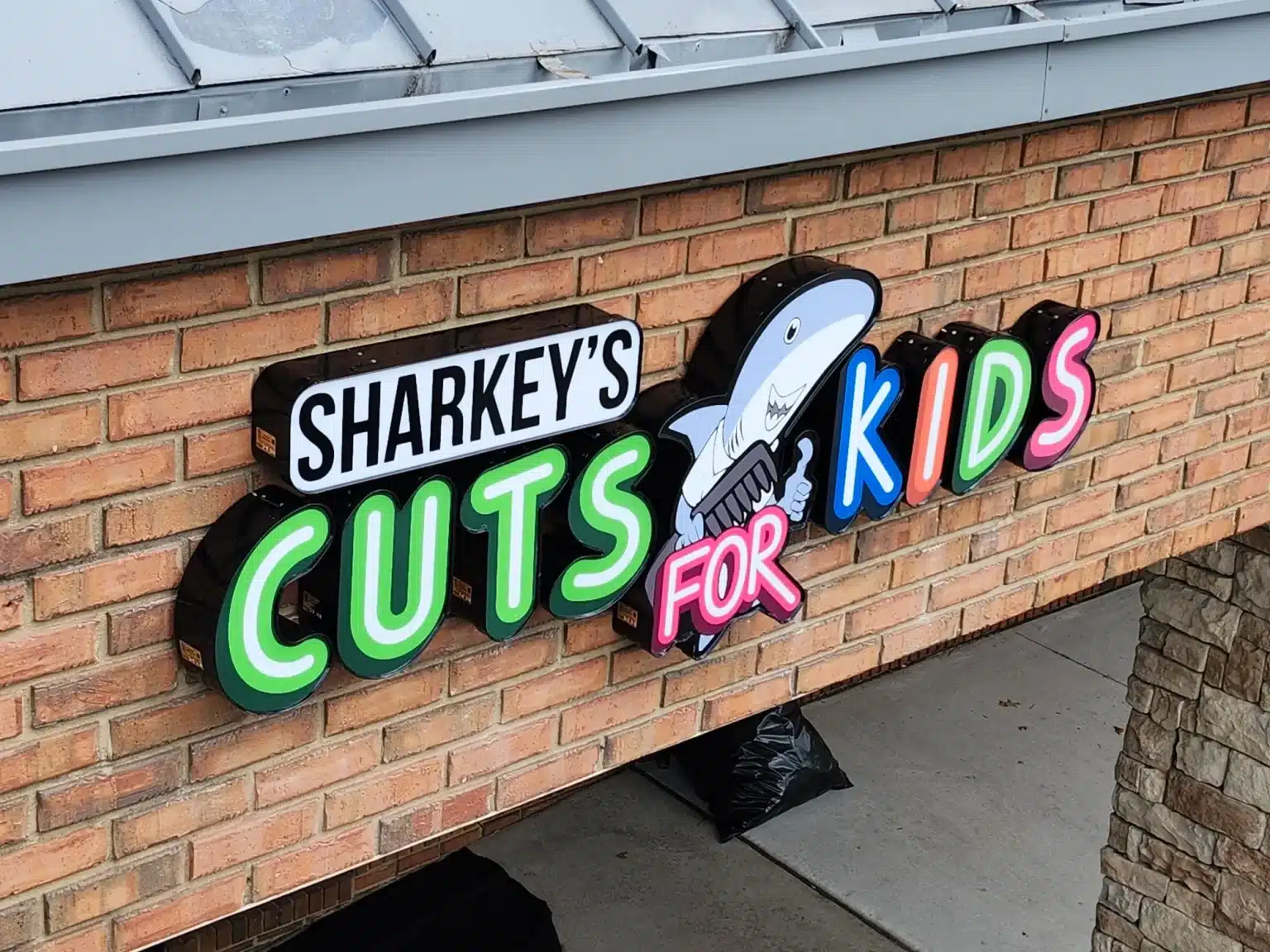 Illuminated channel letter sign, Sharkey's Cuts for Kids, Kennesaw, GA, by High Stakes Creative