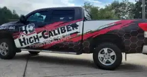 Truck with custom vehicle wrap and branding for High Caliber.