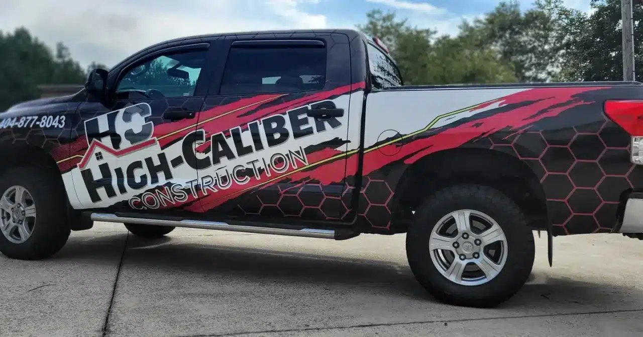 Fleet of vehicles with custom graphics in Atlanta Metro Area, highlighting the benefits of vehicle wraps for businesses