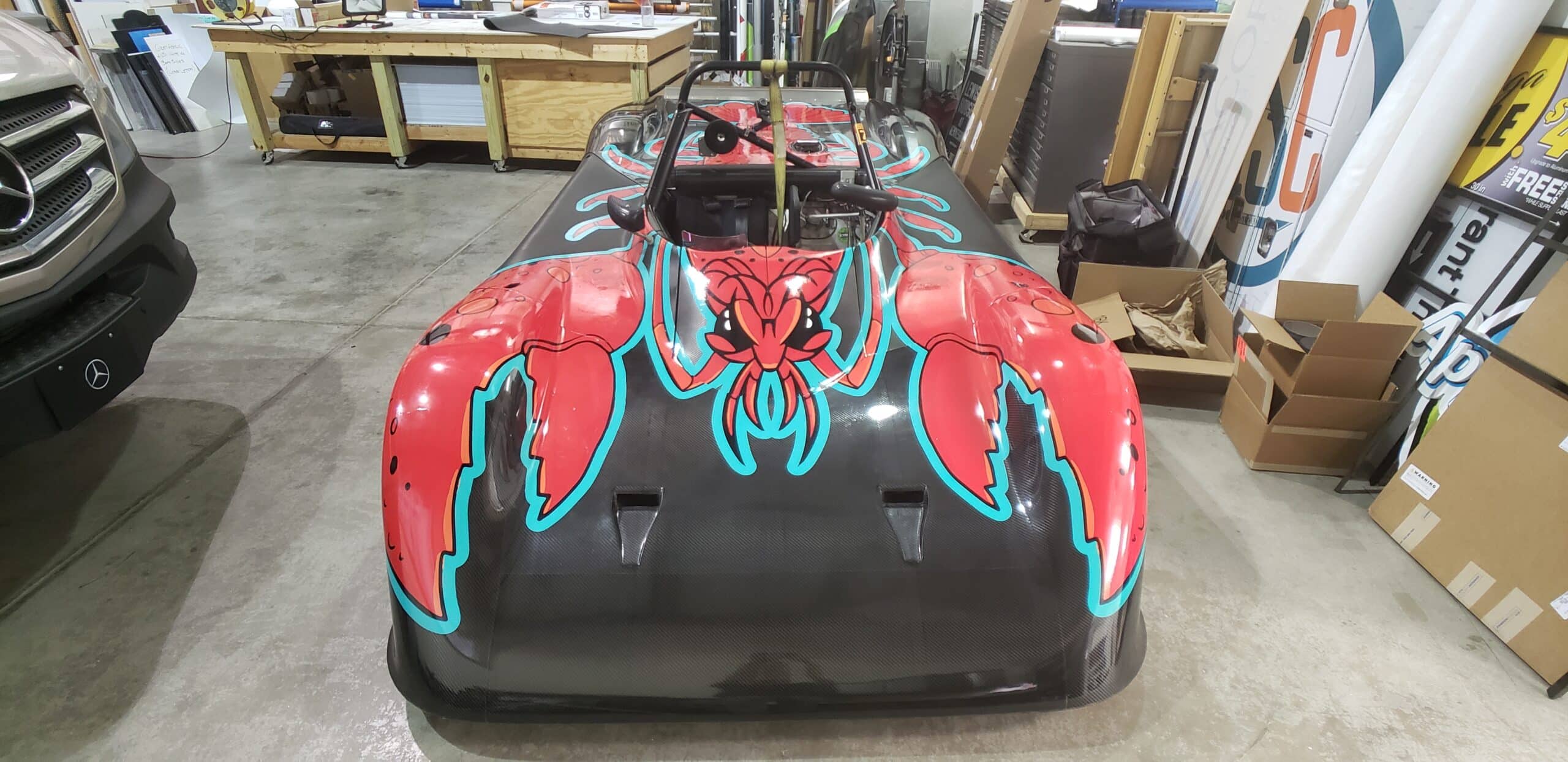 Hand-drawn crawfish race car wrap, by High Stakes Creative