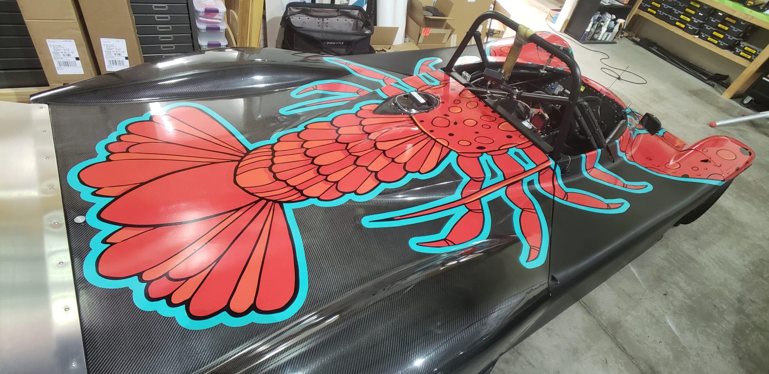 Hand-drawn crawfish race car wrap, by High Stakes Creative