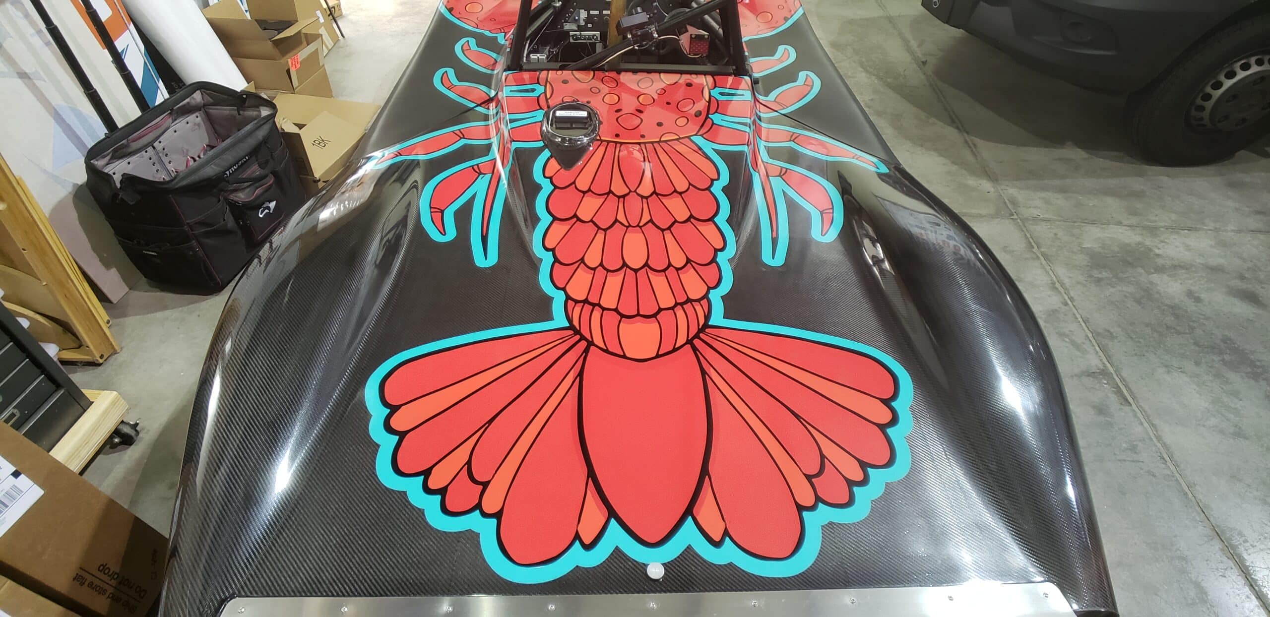 Hand-drawn crawfish race car wrap, by High Stakes Creative