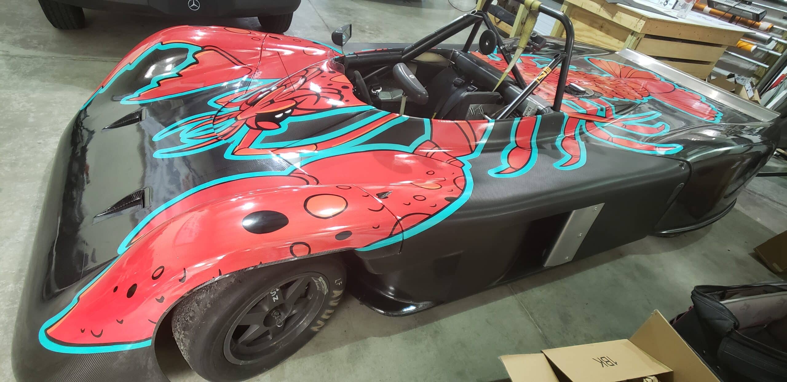 Hand-drawn crawfish race car wrap, by High Stakes Creative