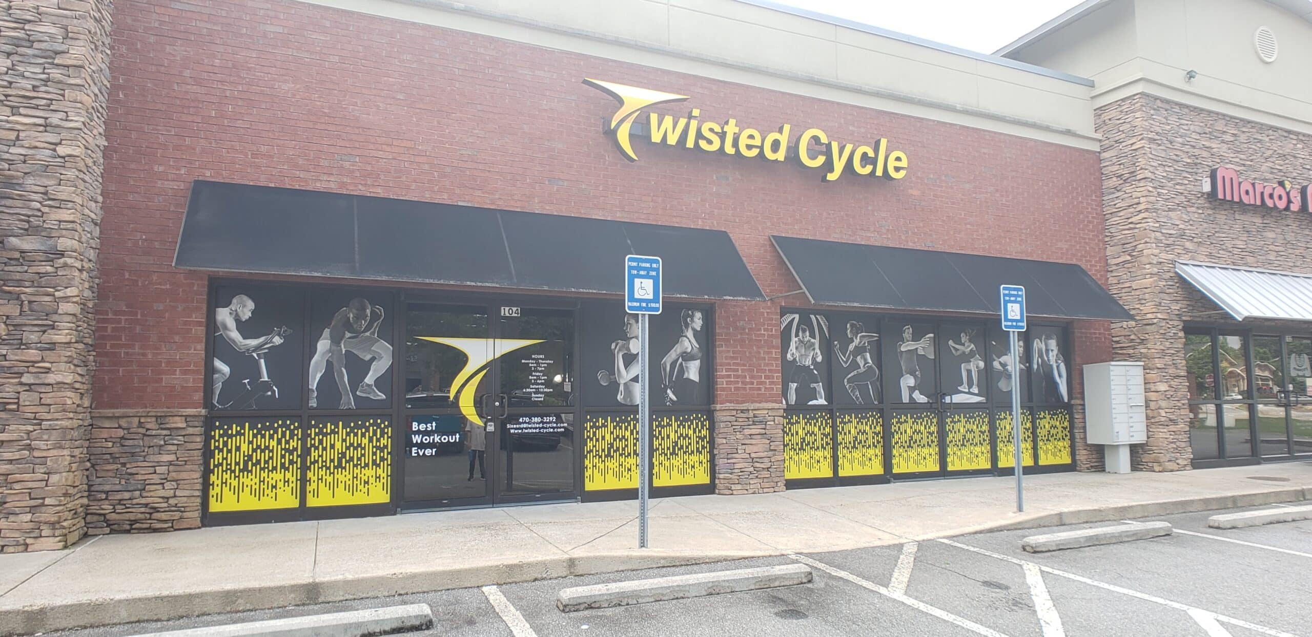 Illuminated sign and athlete window graphics, Twisted Cycle, Woodstock, GA, by High Stakes Creative