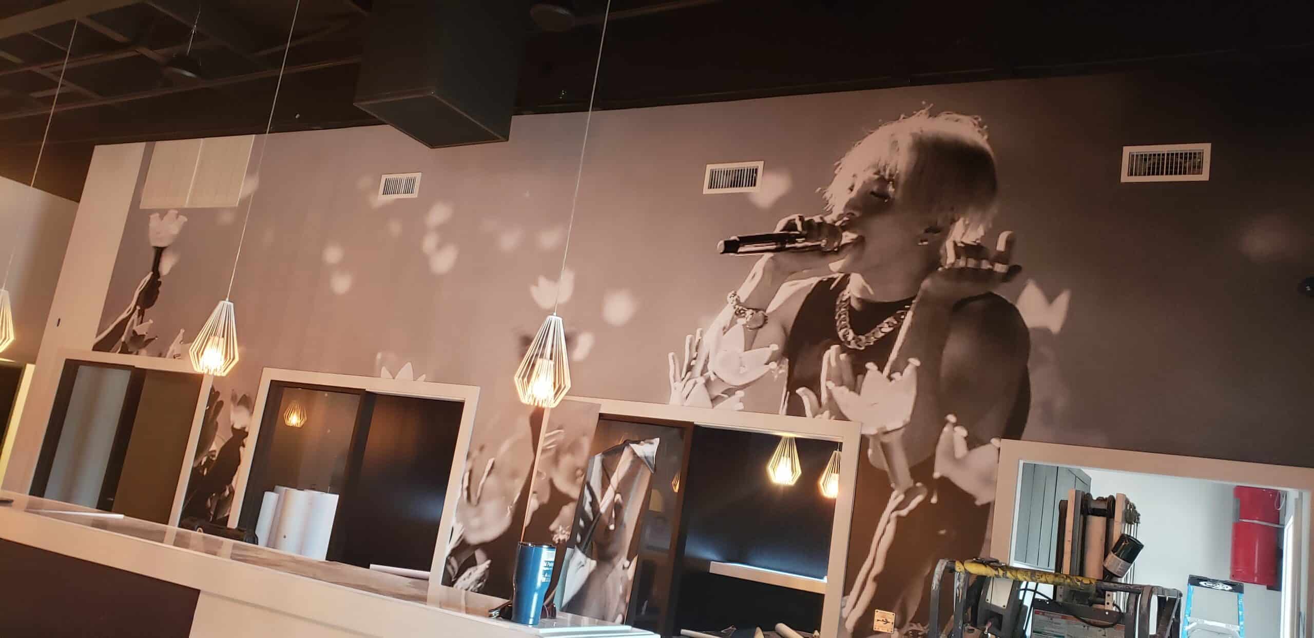 Concert crowd wallcovering for a restaurant and bar, by High Stakes Creative