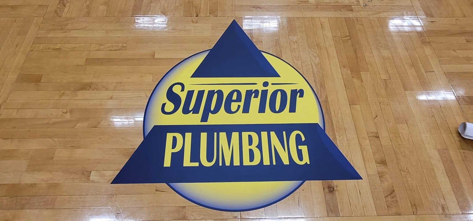 Gym floor logo graphics, Superior Plumbing, Kennesaw, GA, by High Stakes Creative