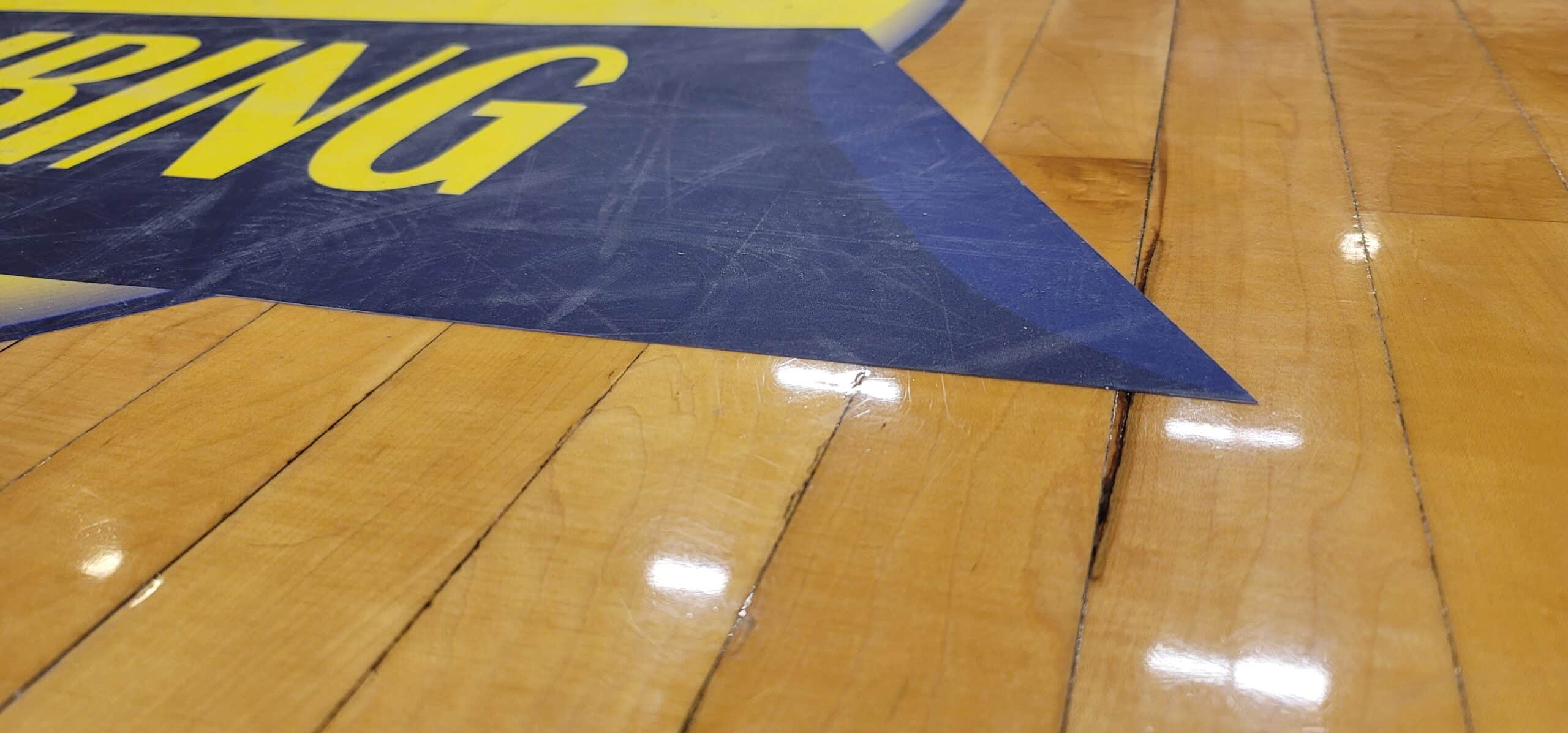 Gym floor logo graphics, Superior Plumbing, Kennesaw, GA, by High Stakes Creative