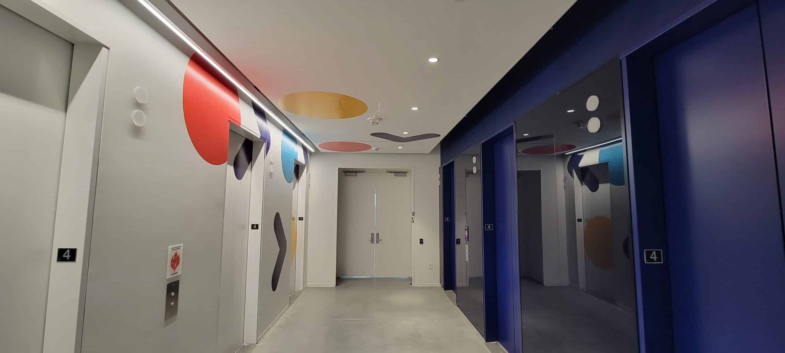 Elevator lobby and corridor wall graphics, by High Stakes Creative