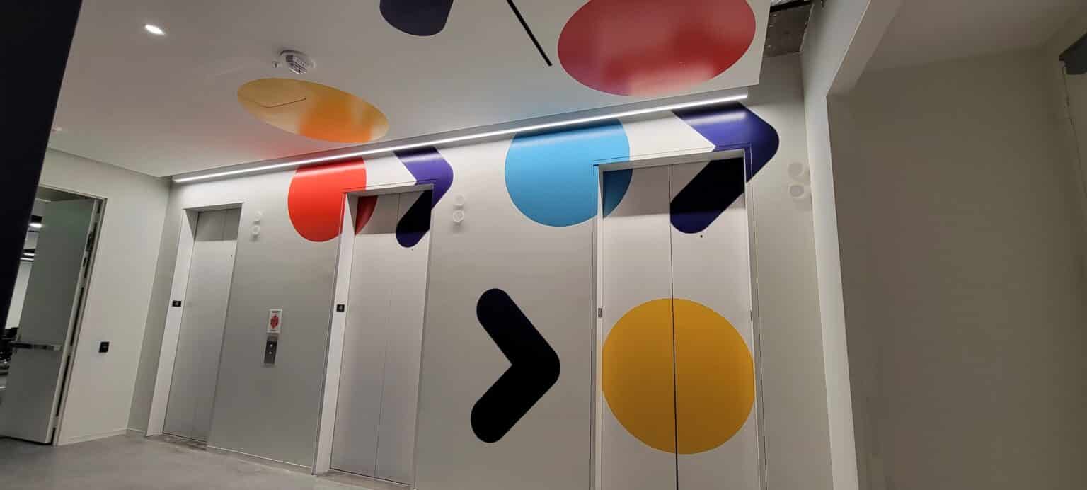 Elevator lobby and corridor wall graphics, by High Stakes Creative
