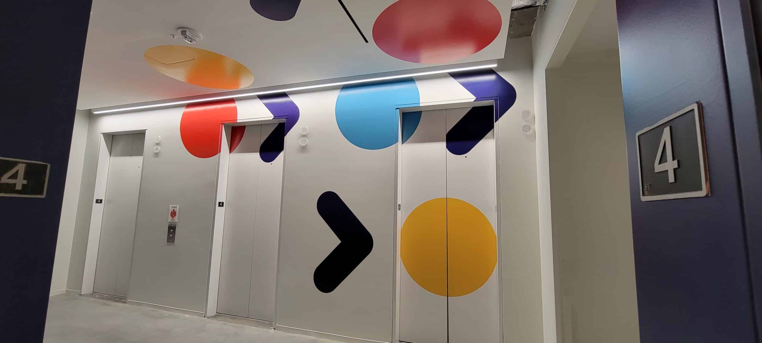 Elevator lobby and corridor wall graphics, by High Stakes Creative