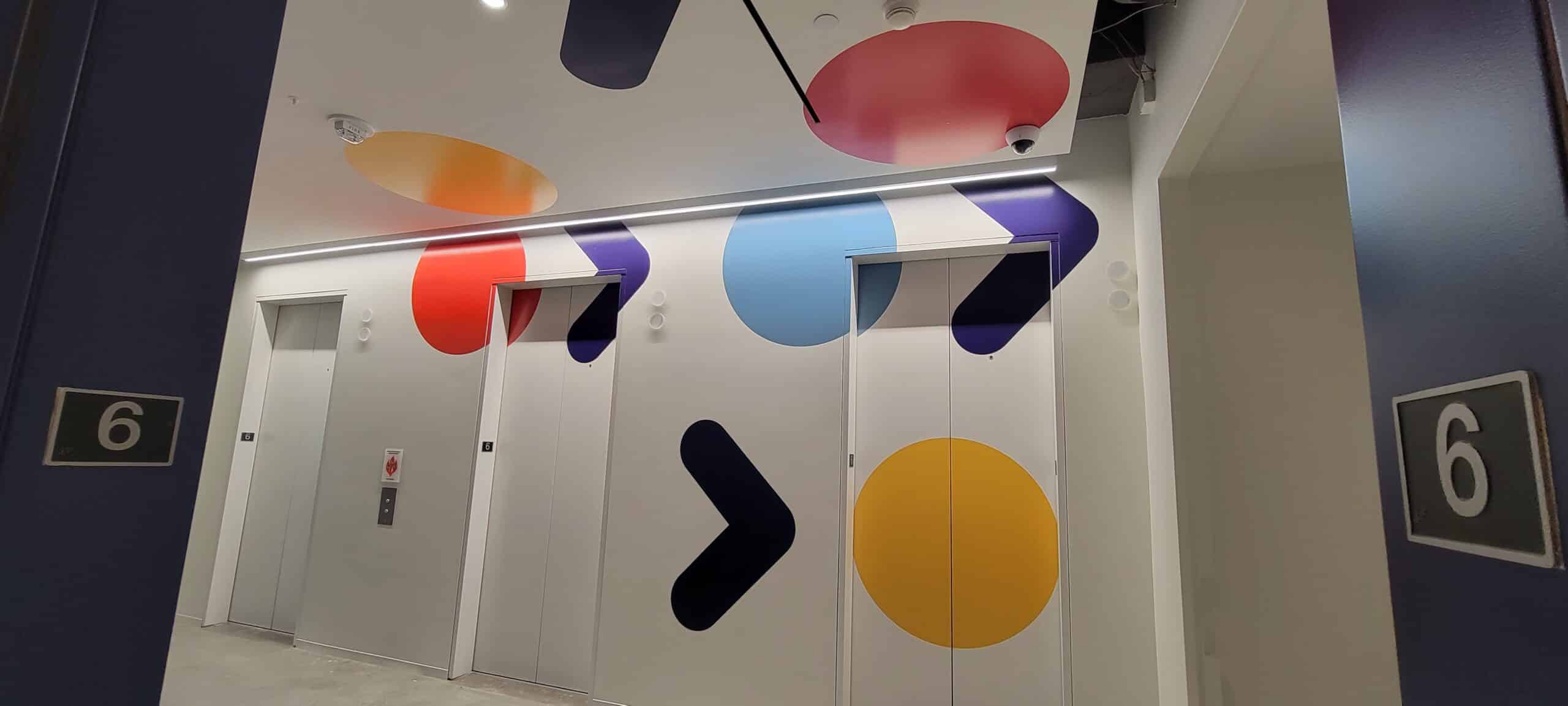 Elevator lobby and corridor wall graphics, by High Stakes Creative
