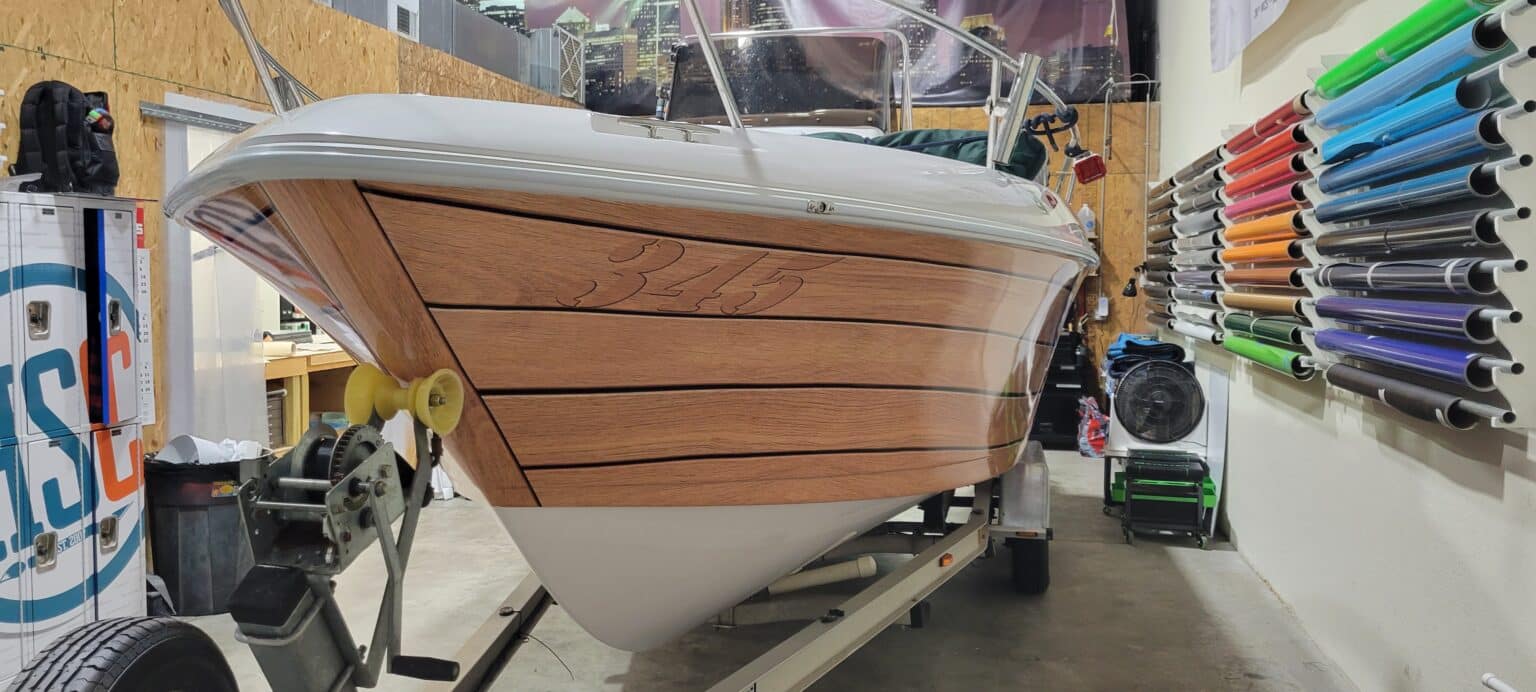 Woodgrain boat wrap, by High Stakes Creative