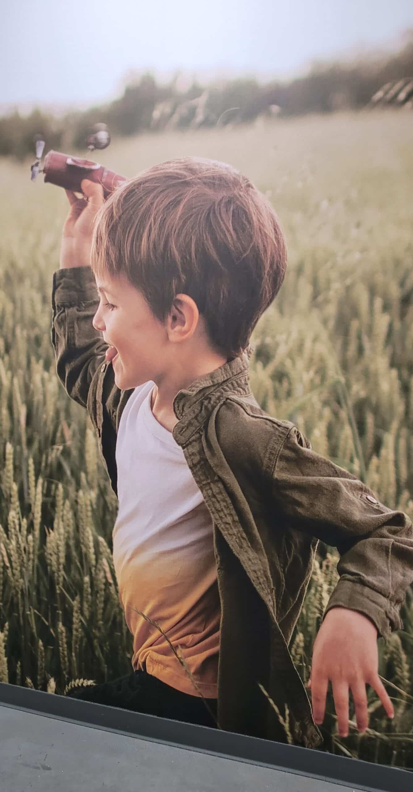 Child in wheat field mural, Kerry, Rome, GA, by High Stakes Creative