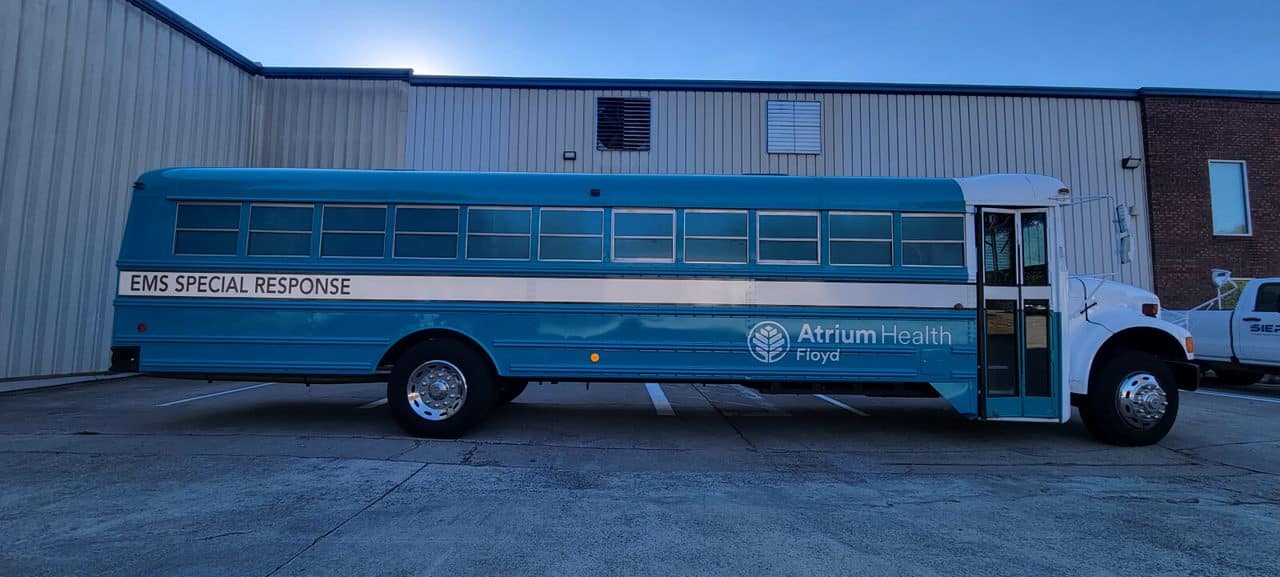 EMS bus wrap side, by High Stakes Creative