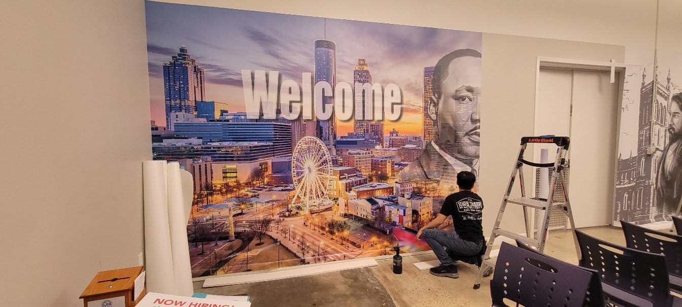 Installing the Atlanta skyline welcome mural, by High Stakes Creative