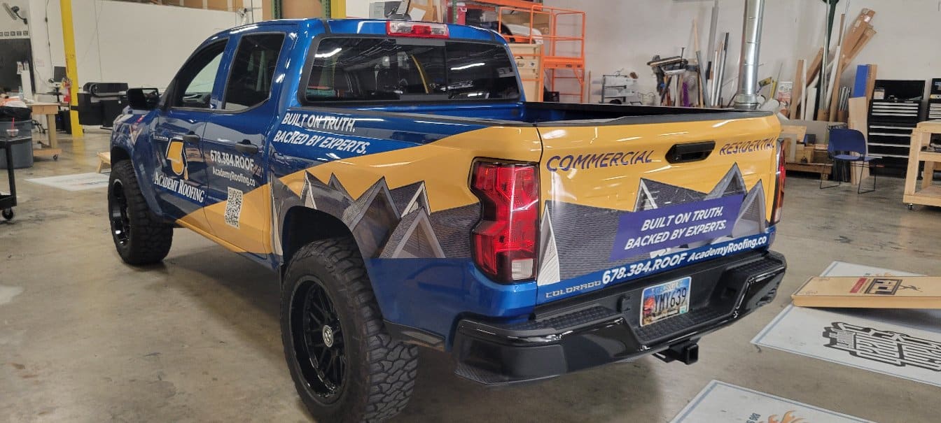 Blue pickup wrap rear quarter, Academy Roofing, Acworth, GA, by High Stakes Creative