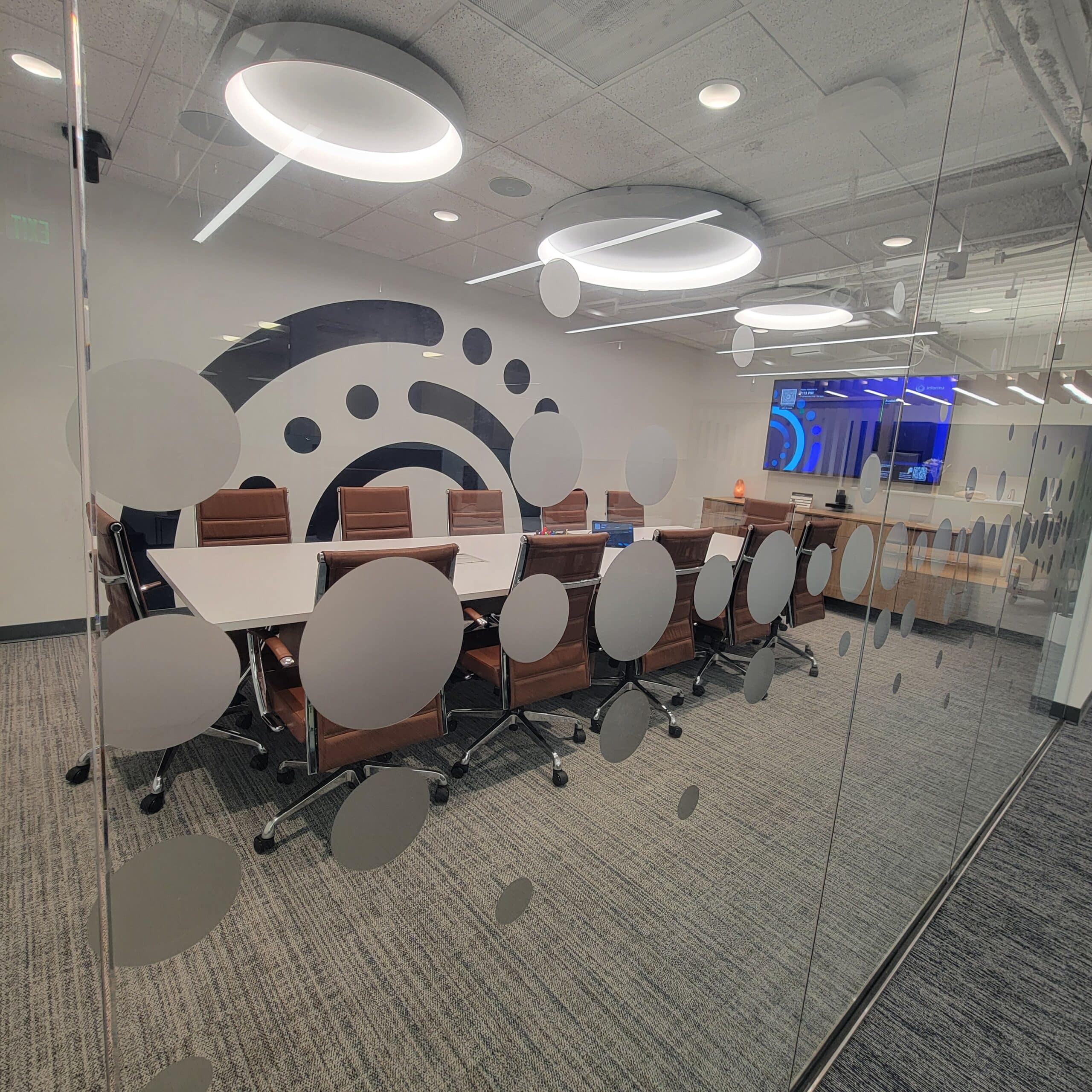 Dot-pattern glass graphics, Informa, Sandy Springs, GA, by High Stakes Creative