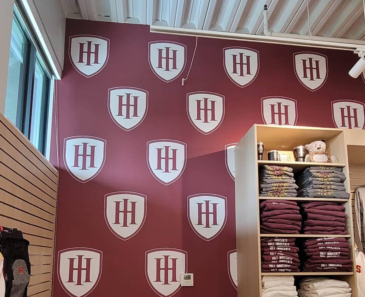 Golden Bears school store wallcovering and logo wall, Holy Innocents' Episcopal School, Sandy Springs, GA, by High Stakes Creative