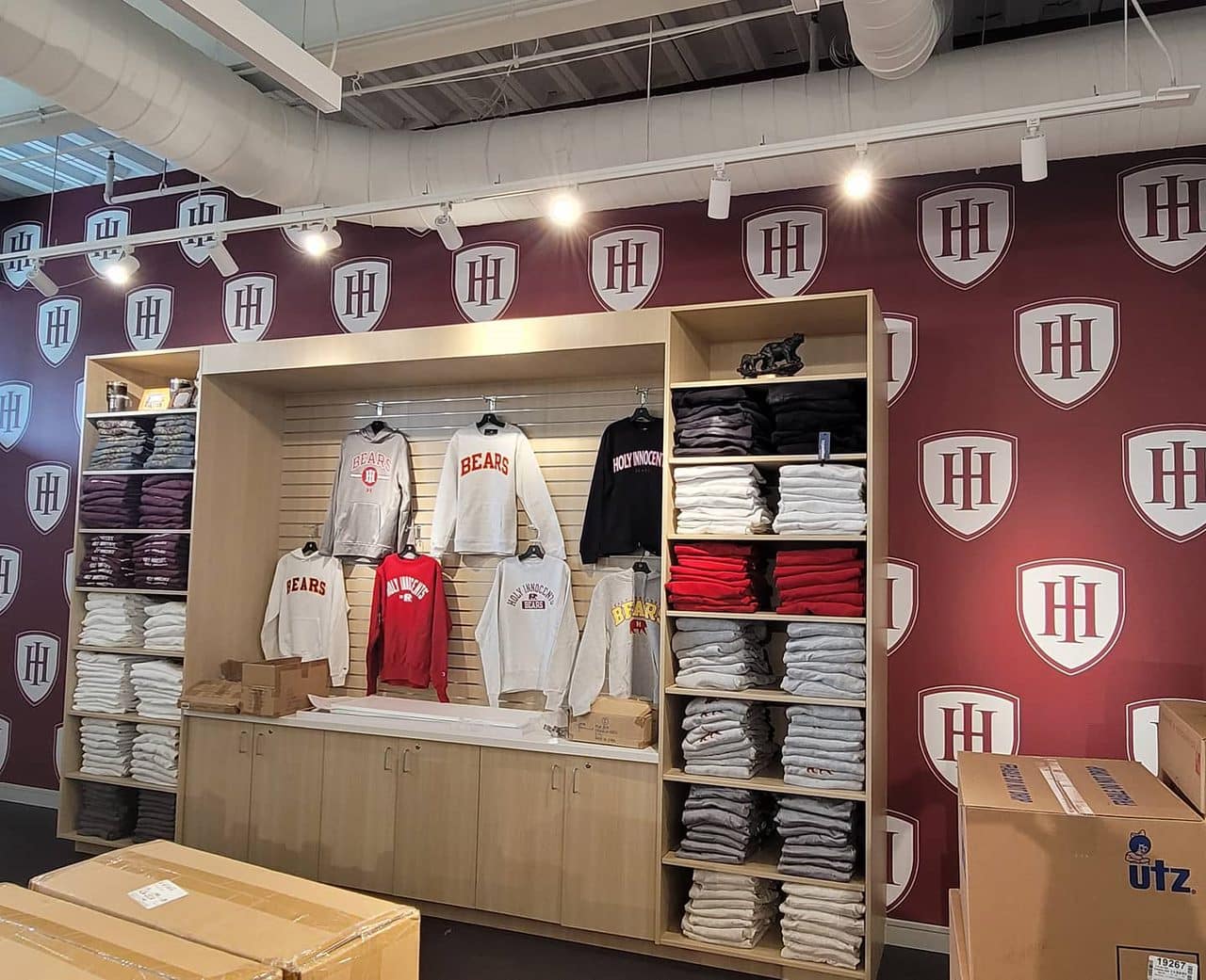 Golden Bears school store wallcovering and logo wall, Holy Innocents' Episcopal School, Sandy Springs, GA, by High Stakes Creative