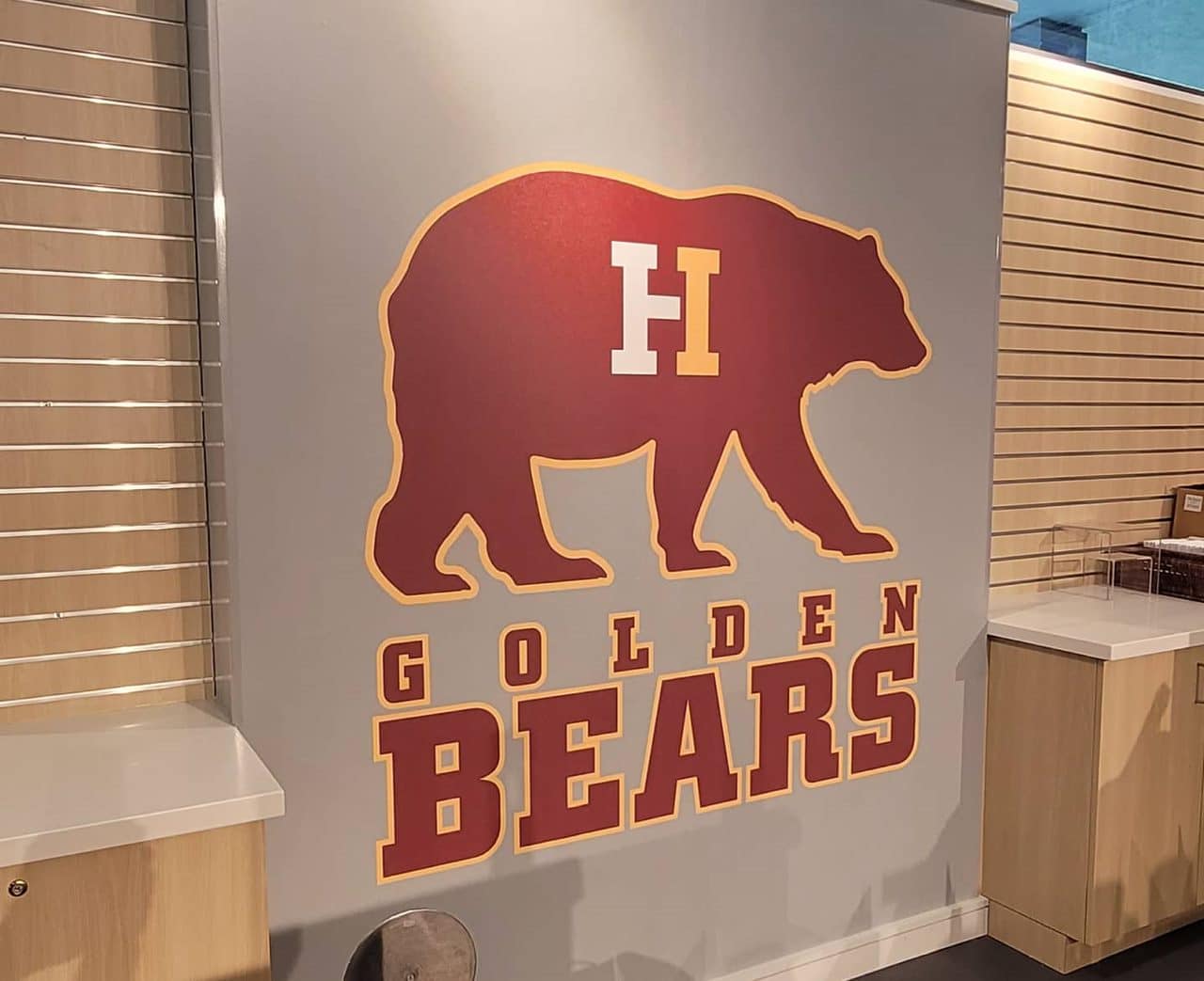 Golden Bears school store wallcovering and logo wall, Holy Innocents' Episcopal School, Sandy Springs, GA, by High Stakes Creative