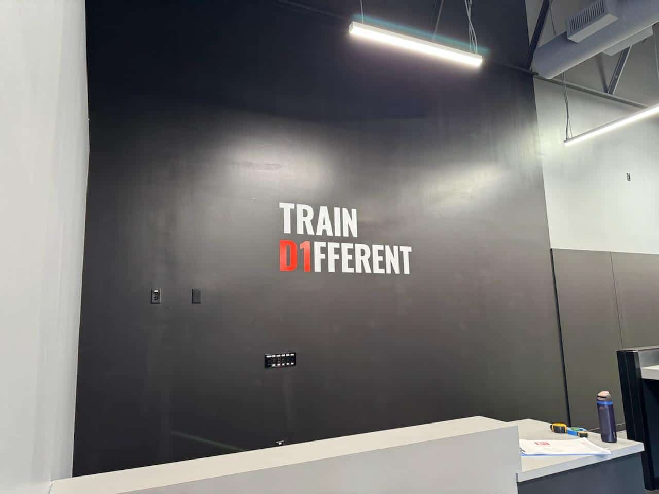 Train Different gym wall, D1 Training, Marietta, GA, by High Stakes Creative