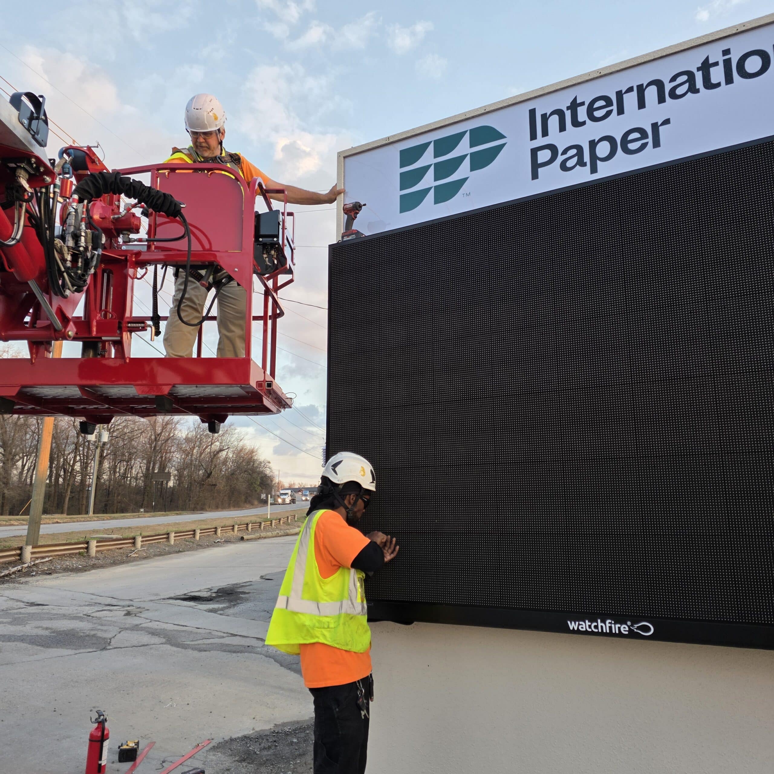 Lift crew installing pylon sign, International Paper, Rome, GA, by High Stakes Creative