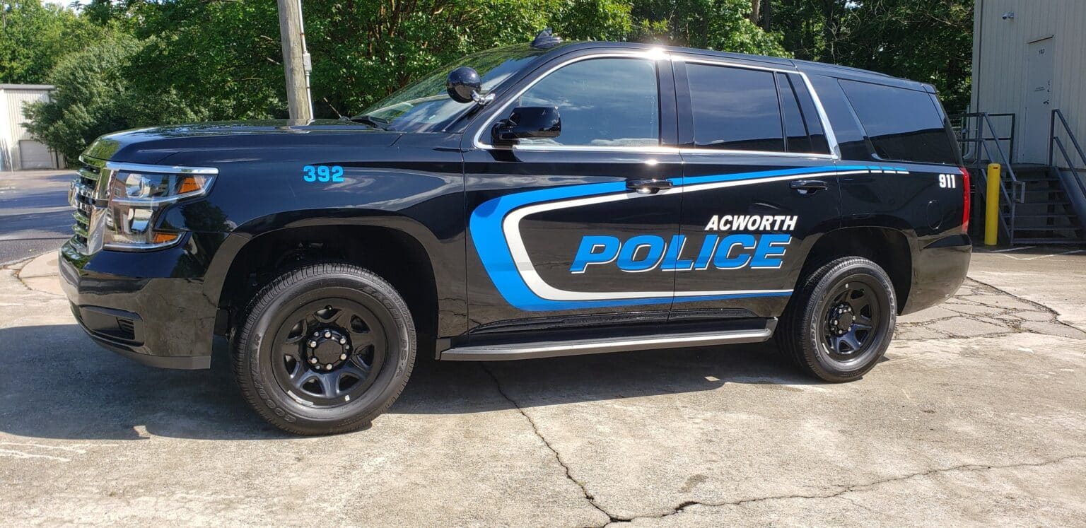 Police graphics with blue swoosh on a black Chevy Tahoe, Acworth Police, Acworth, GA, by High Stakes Creative