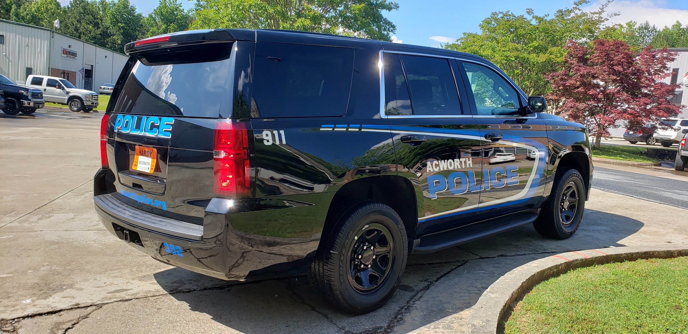 Rear passenger-side view of Acworth Police Tahoe graphics, Acworth Police, Acworth, GA, by High Stakes Creative