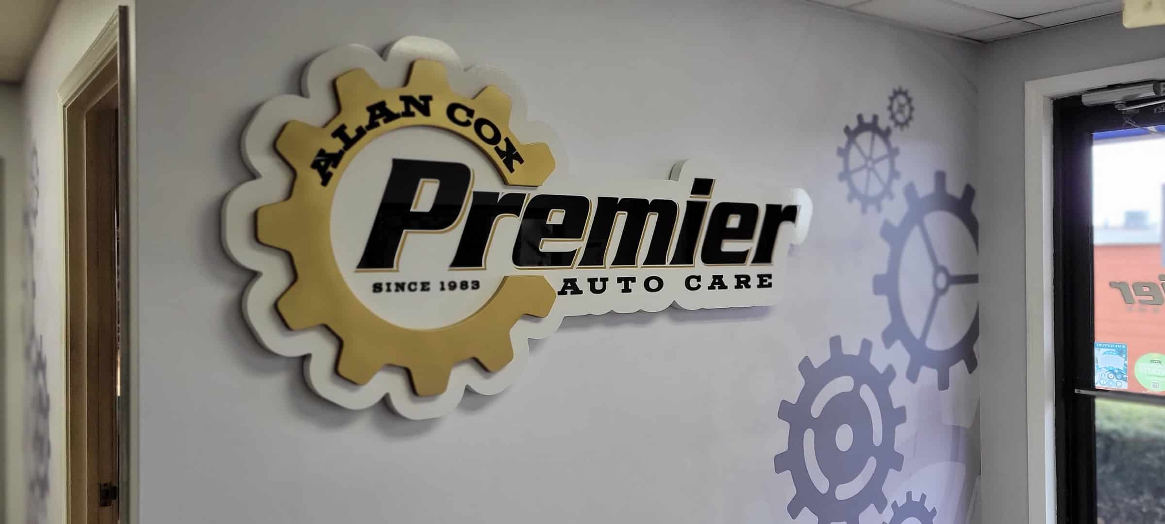 Close view of dimensional logo and gears, Alan Cox Premier Auto Care, by High Stakes Creative