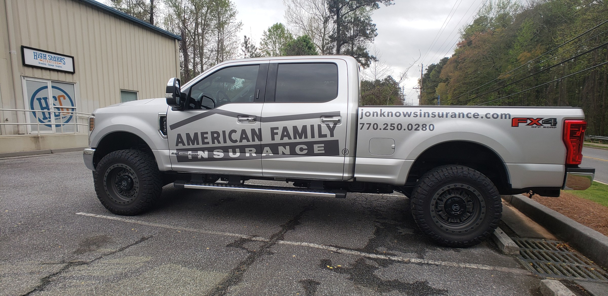 Side lettering, web address and phone on silver Ford F-250, passenger side, American Family Insurance, by High Stakes Creative