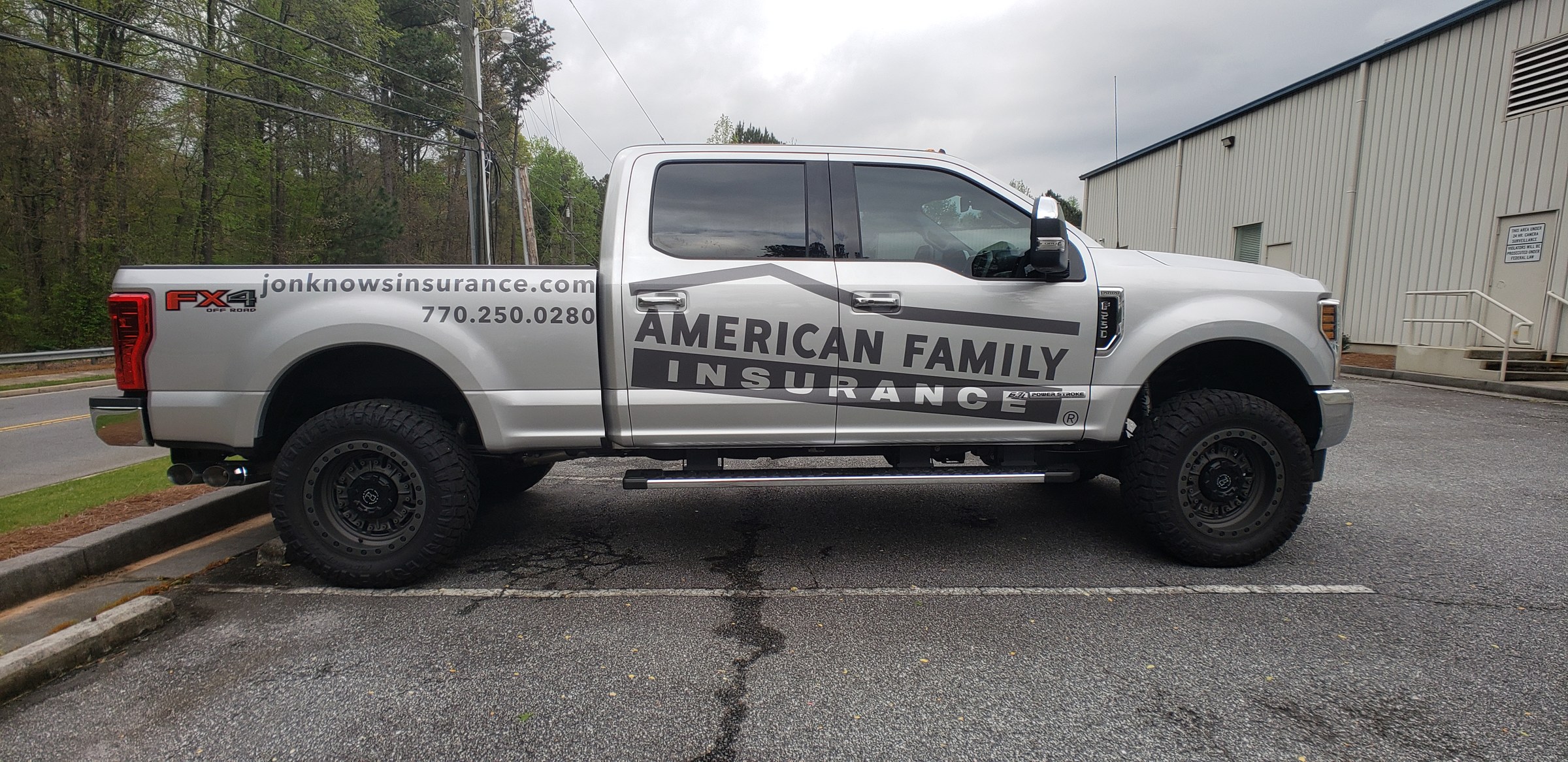 Driver-side graphics on silver Ford F-250, American Family Insurance, by High Stakes Creative