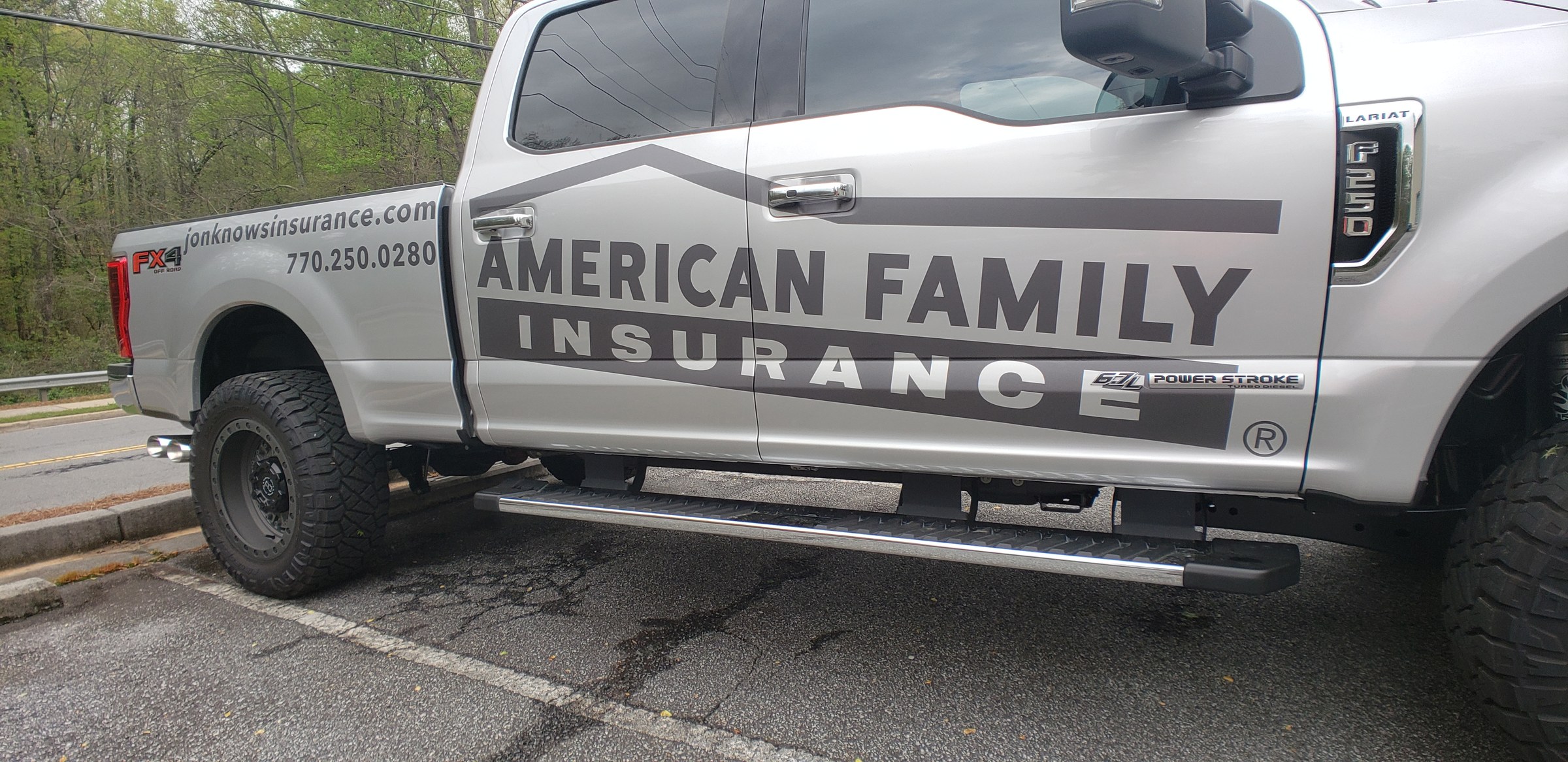 Front three-quarter of silver F-250 with American Family Insurance lettering, American Family Insurance, by High Stakes Creative