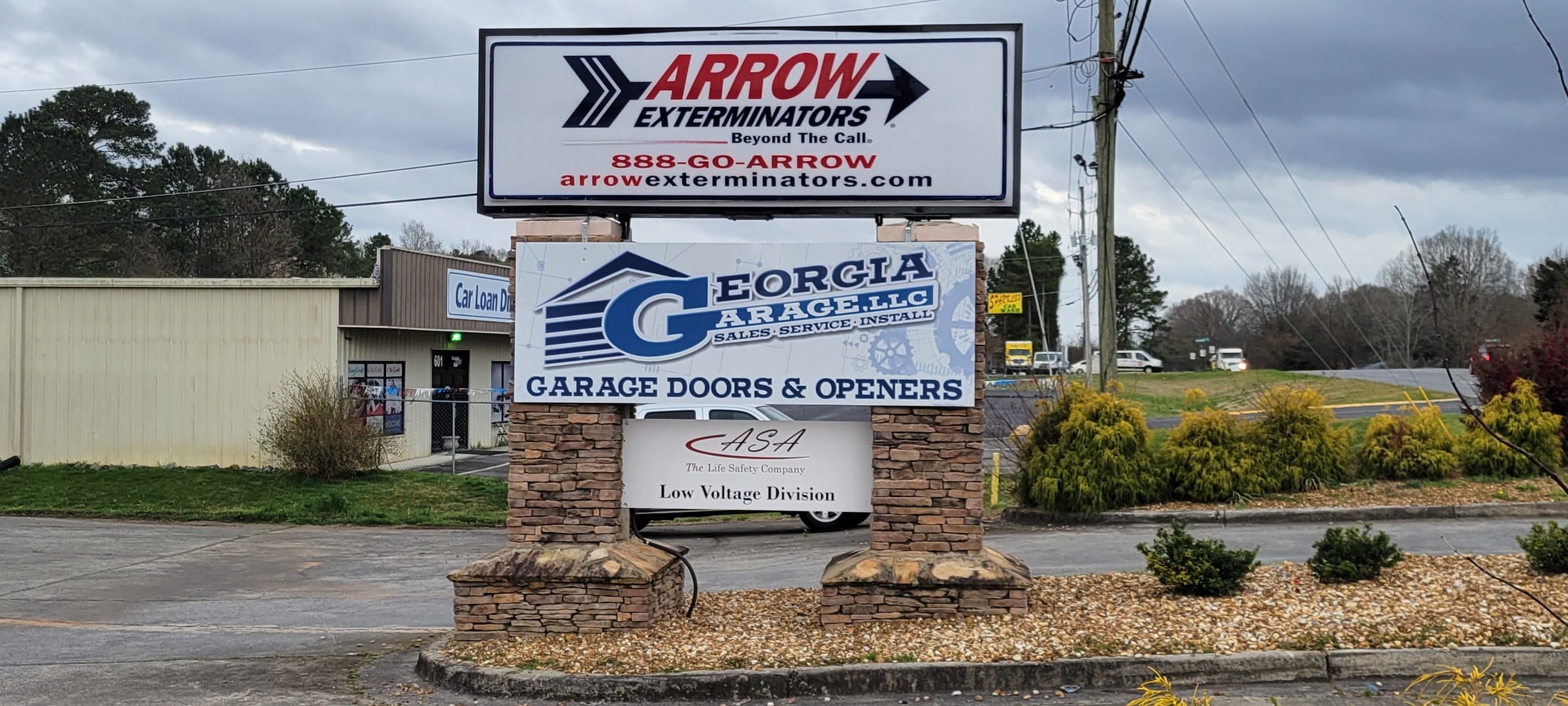 Pylon with Arrow Exterminators and Georgia Garage panels, Arrow Exterminators, by High Stakes Creative