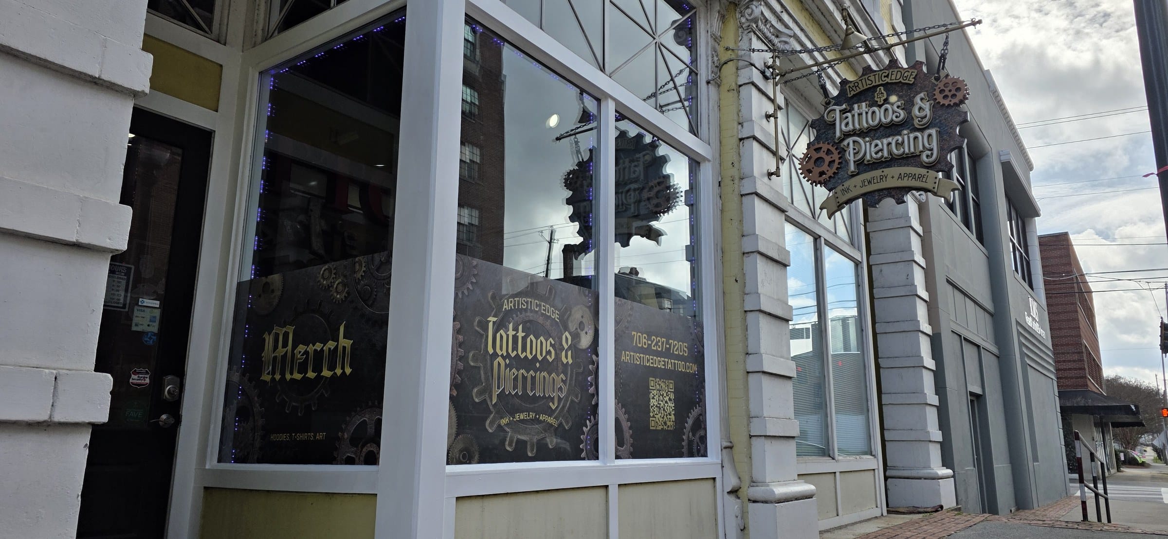 Steampunk gear storefront window graphics (Tattoos & Piercings, Merch) and door sidelight , Artistic Edge Tattoos & Piercing, Rome, GA, by High Stakes Creative