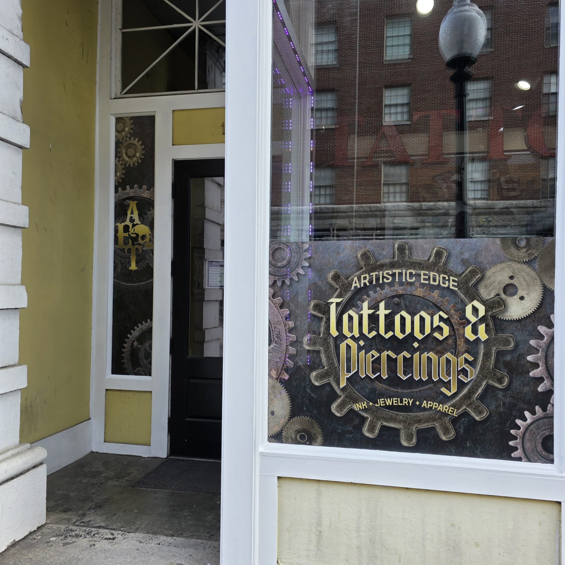 Steampunk gear storefront window graphics (Tattoos & Piercings, Merch) and door sidelight , Artistic Edge Tattoos & Piercing, Rome, GA, by High Stakes Creative
