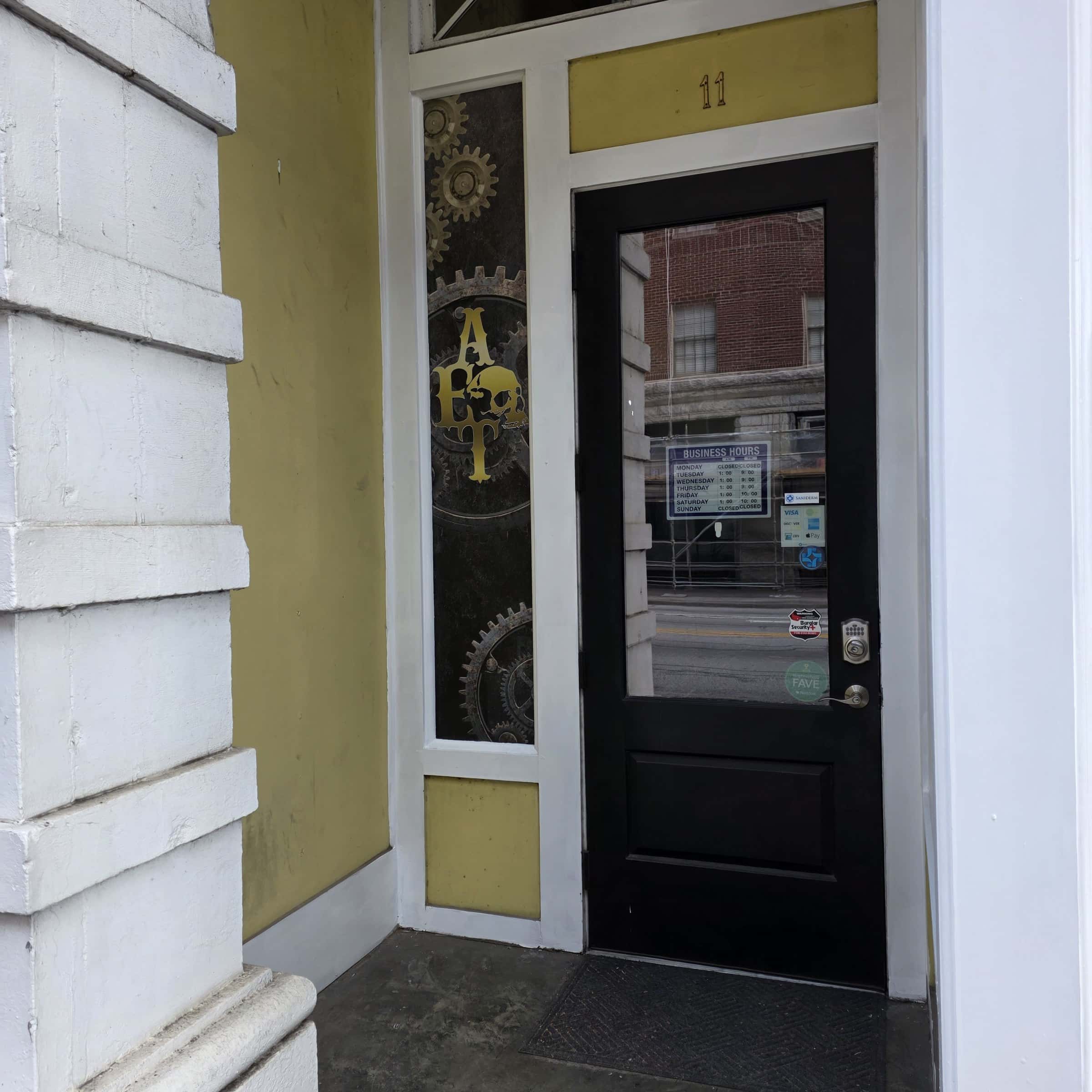 Steampunk gear storefront window graphics (Tattoos & Piercings, Merch) and door sidelight , Artistic Edge Tattoos & Piercing, Rome, GA, by High Stakes Creative