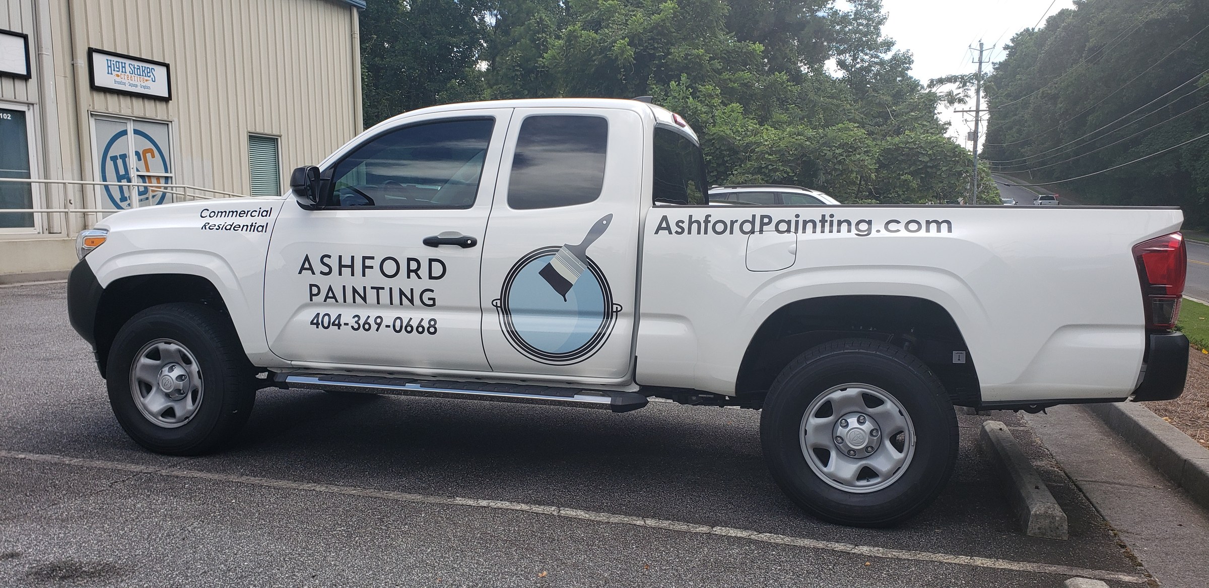 Logo, phone and web graphics on a white Toyota Tacoma, Ashford Painting, by High Stakes Creative