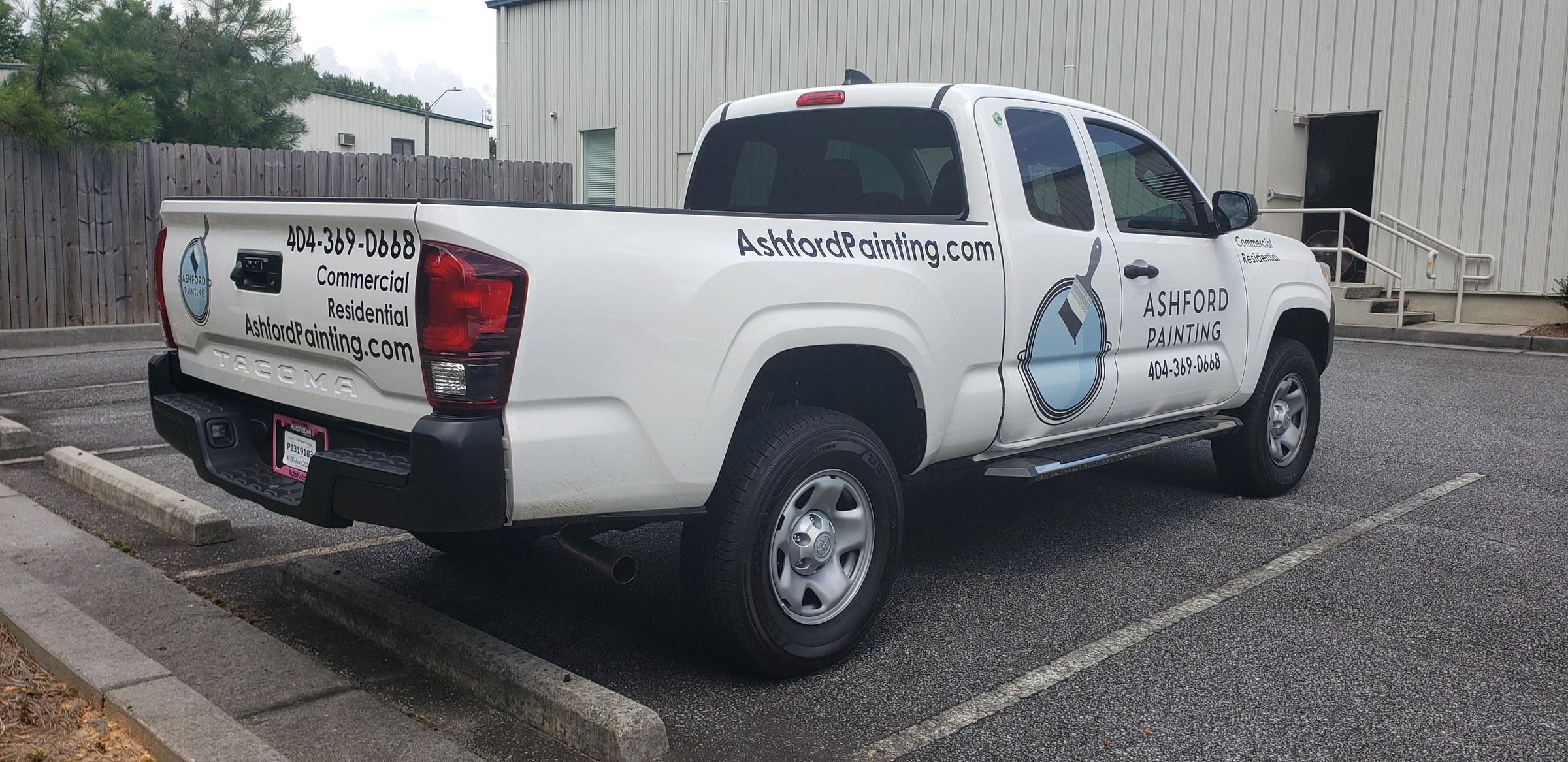 Rear three-quarter of Tacoma with tailgate and side lettering, Ashford Painting, by High Stakes Creative
