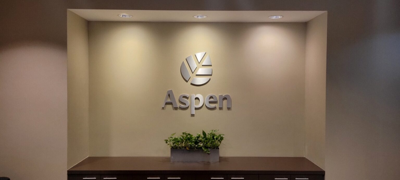 Dimensional Aspen logo in lit lobby niche, Aspen, by High Stakes Creative