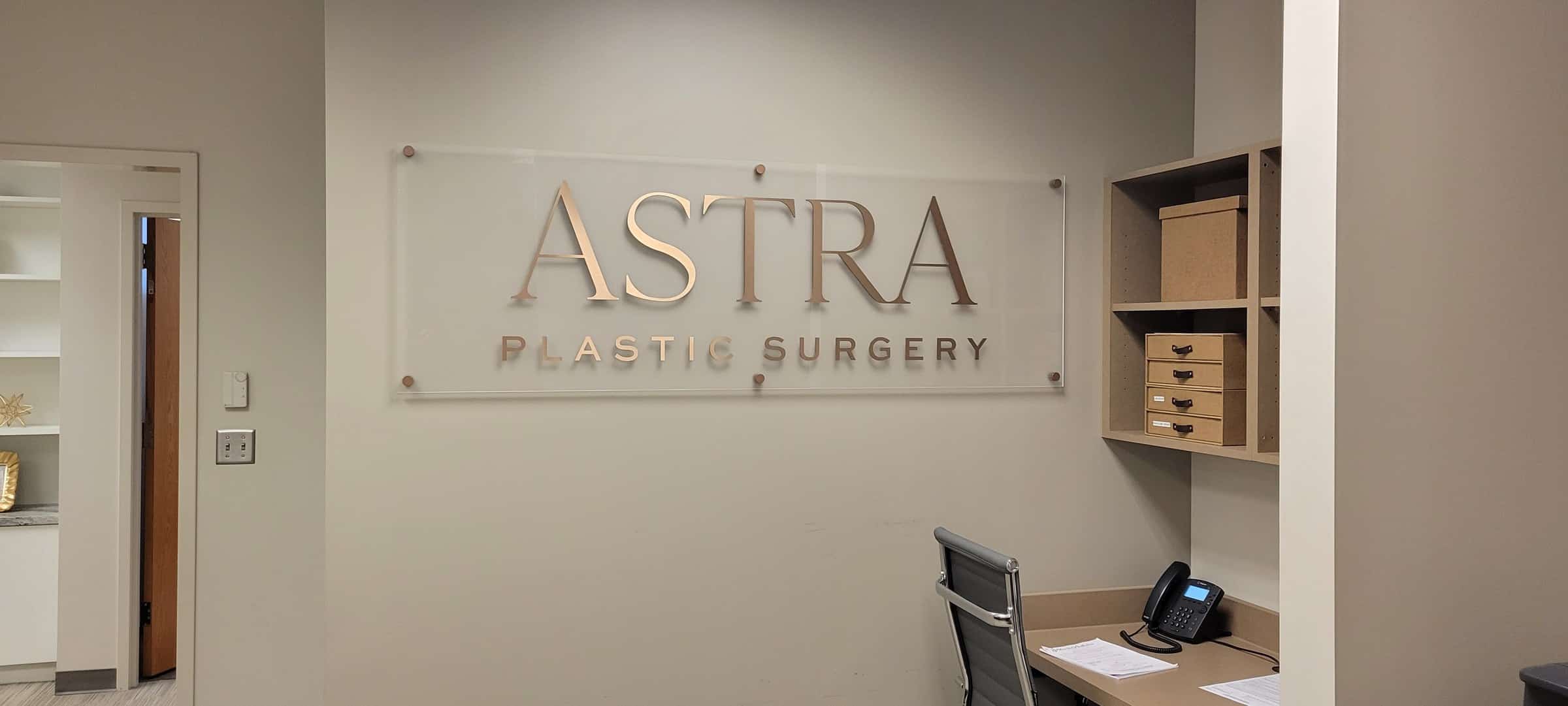 Acrylic logo panel in office, Astra Plastic Surgery, by High Stakes Creative