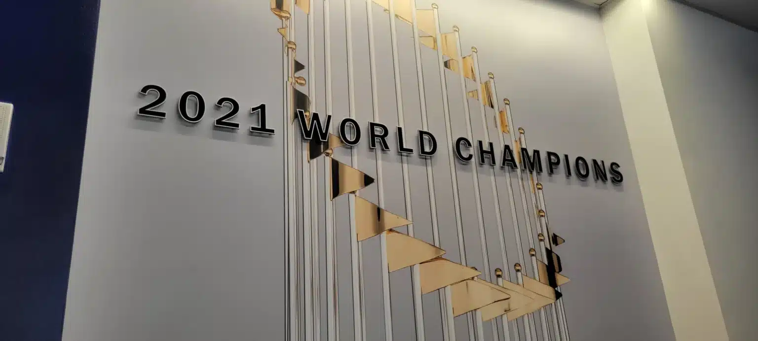 Raised 2021 World Champions lettering and a large World Series trophy wall graphic in the Atlanta Braves lobby, by High Stakes Creative