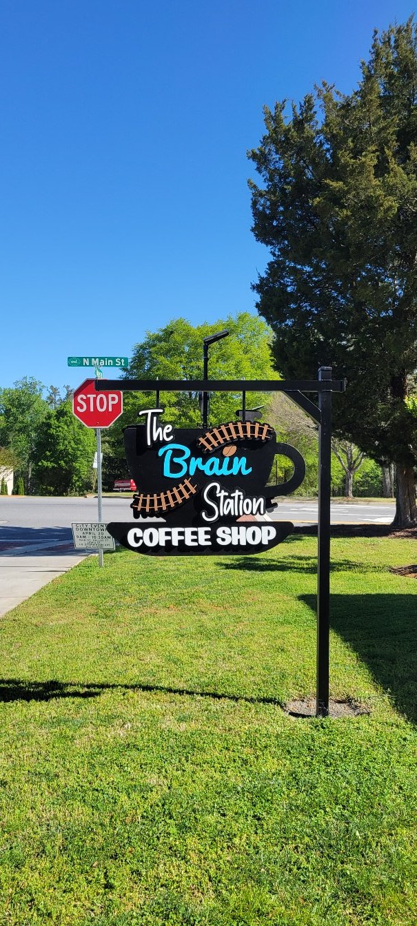 Sign at street corner, The Brain Station Coffee Shop, by High Stakes Creative