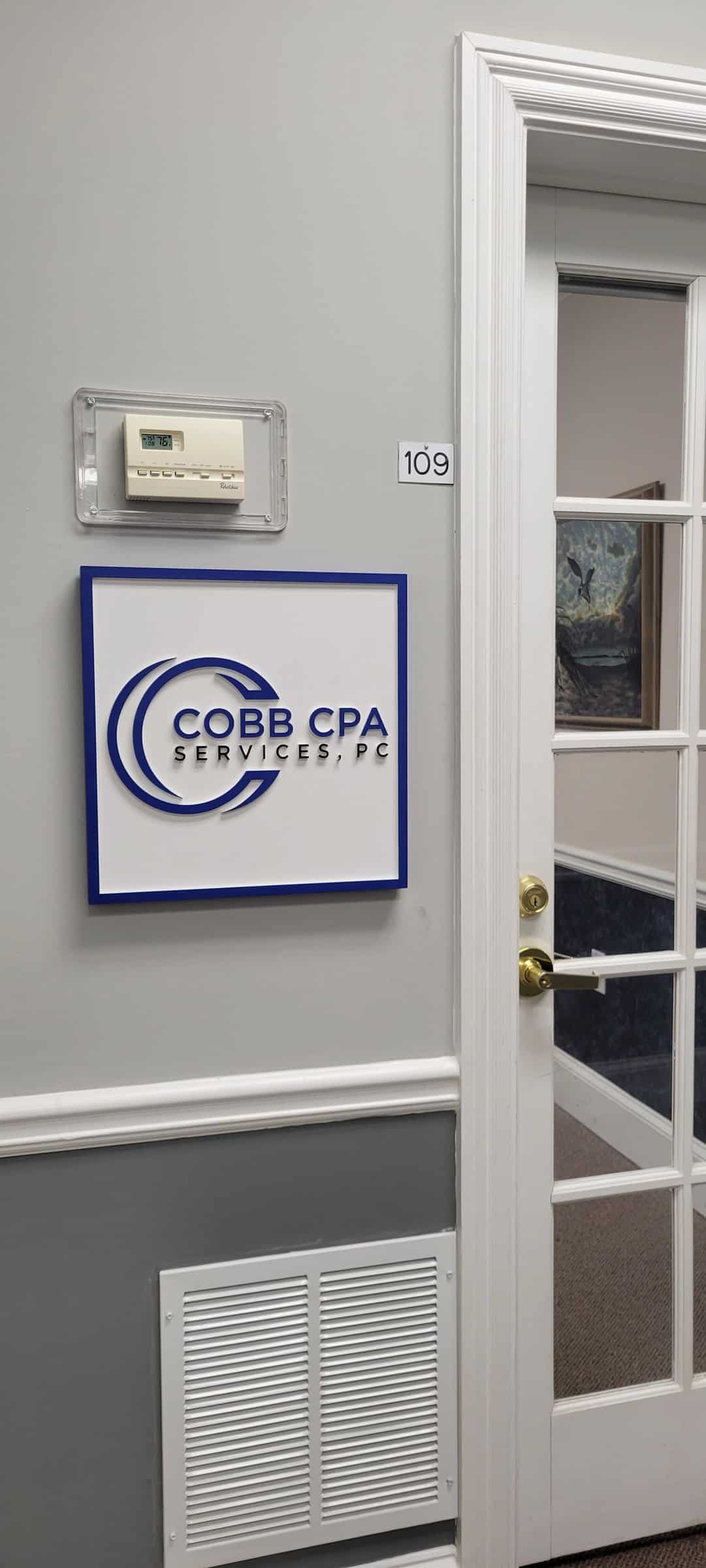 Dimensional suite sign beside office door 109, Cobb CPA Services, by High Stakes Creative