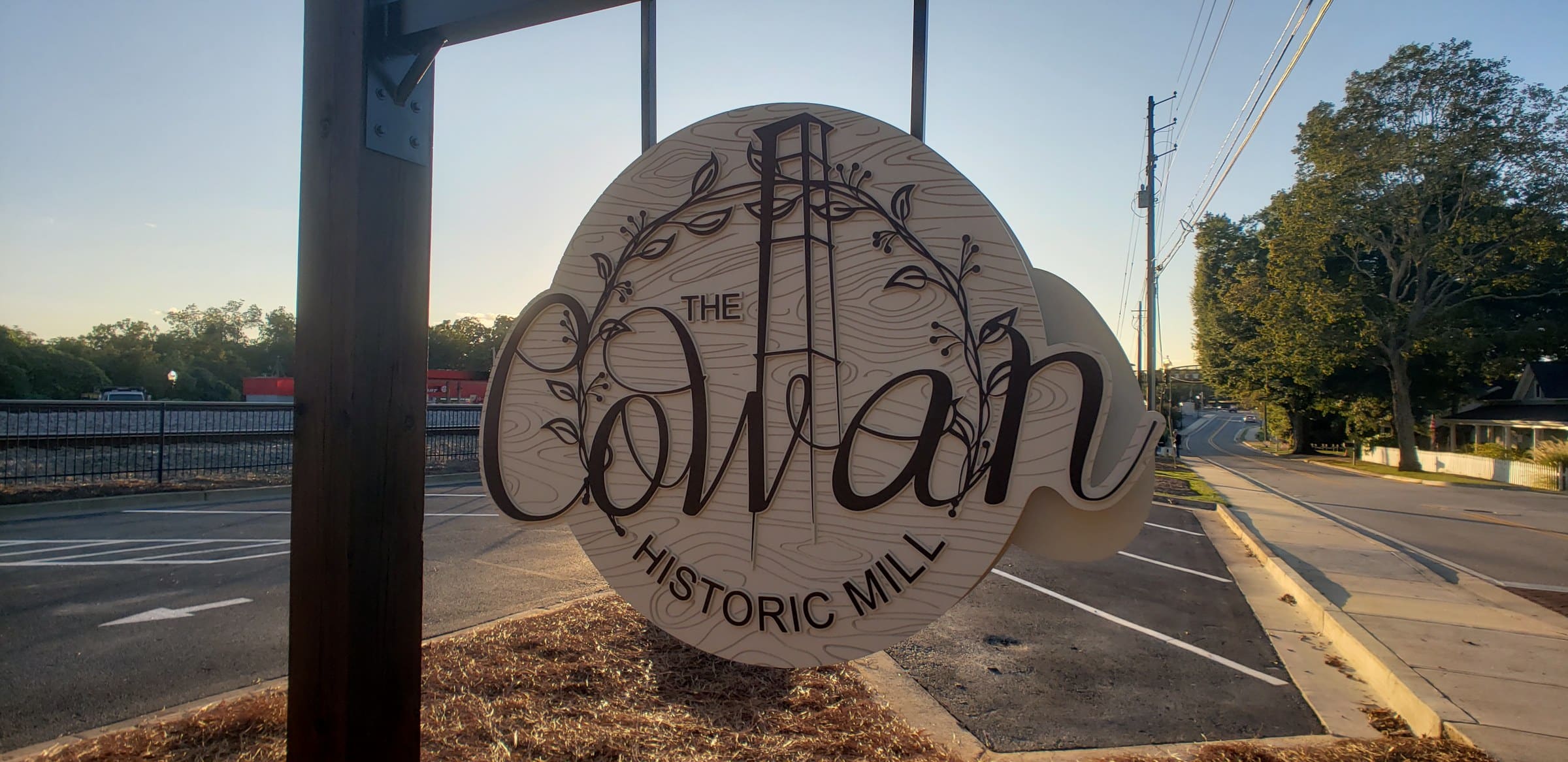 Carved hanging sign, back face, The Cowan Historic Mill, Acworth, GA, by High Stakes Creative