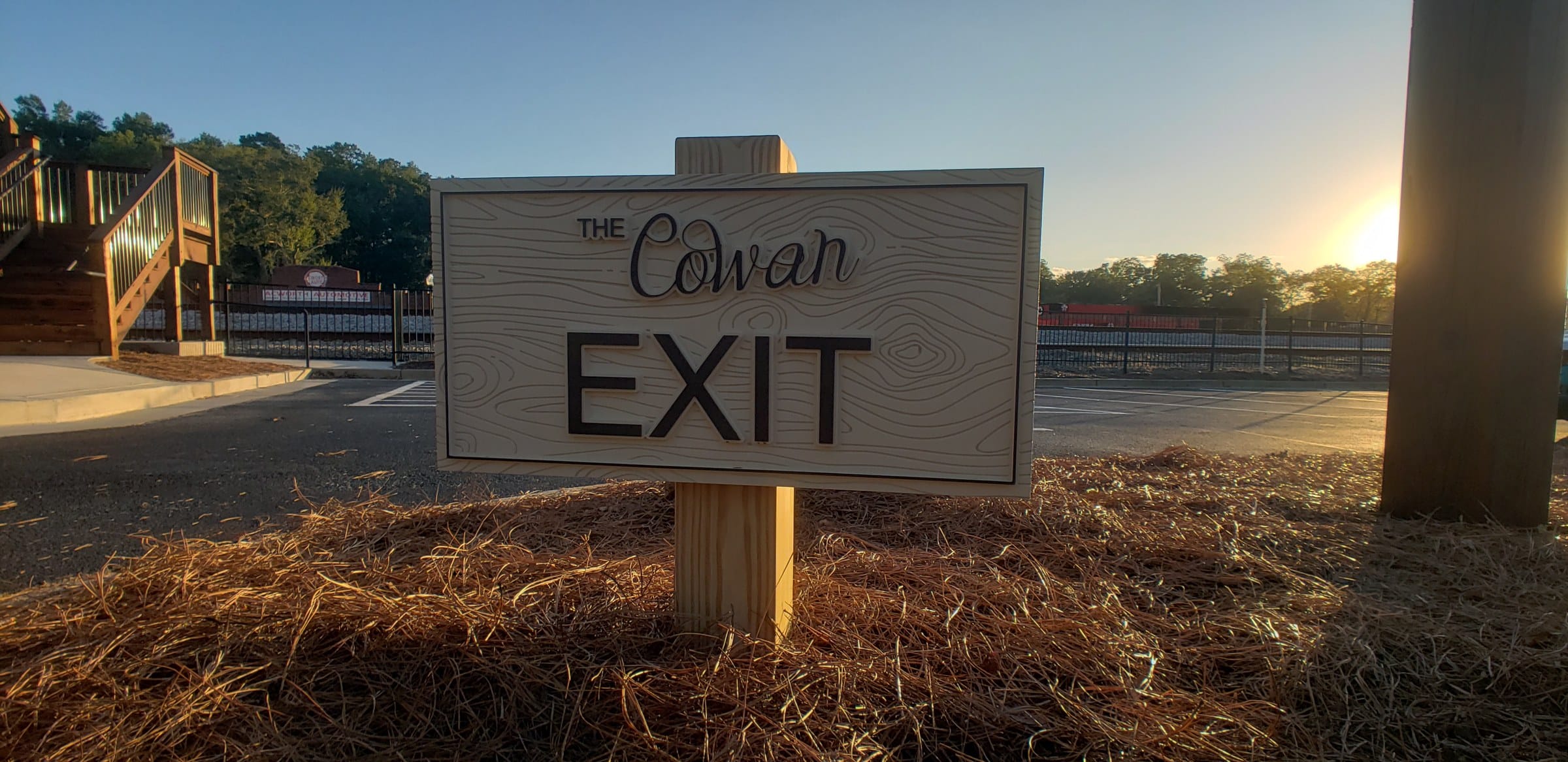 Carved EXIT directional sign, The Cowan Historic Mill, Acworth, GA, by High Stakes Creative