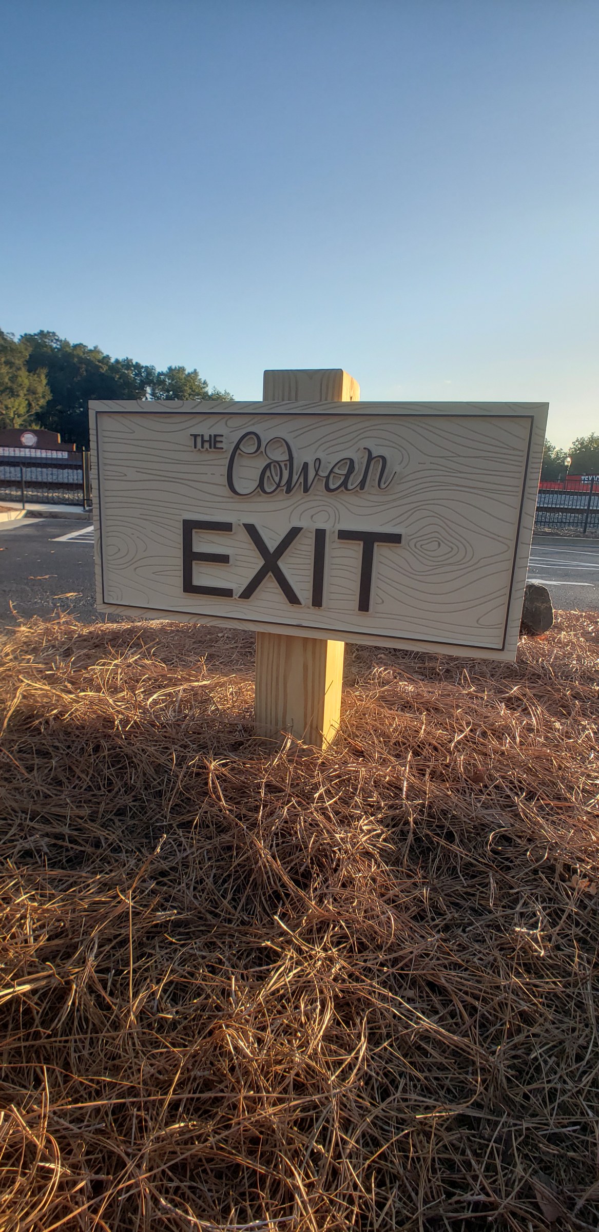 Carved EXIT directional sign on a wood post, The Cowan Historic Mill, Acworth, GA, by High Stakes Creative