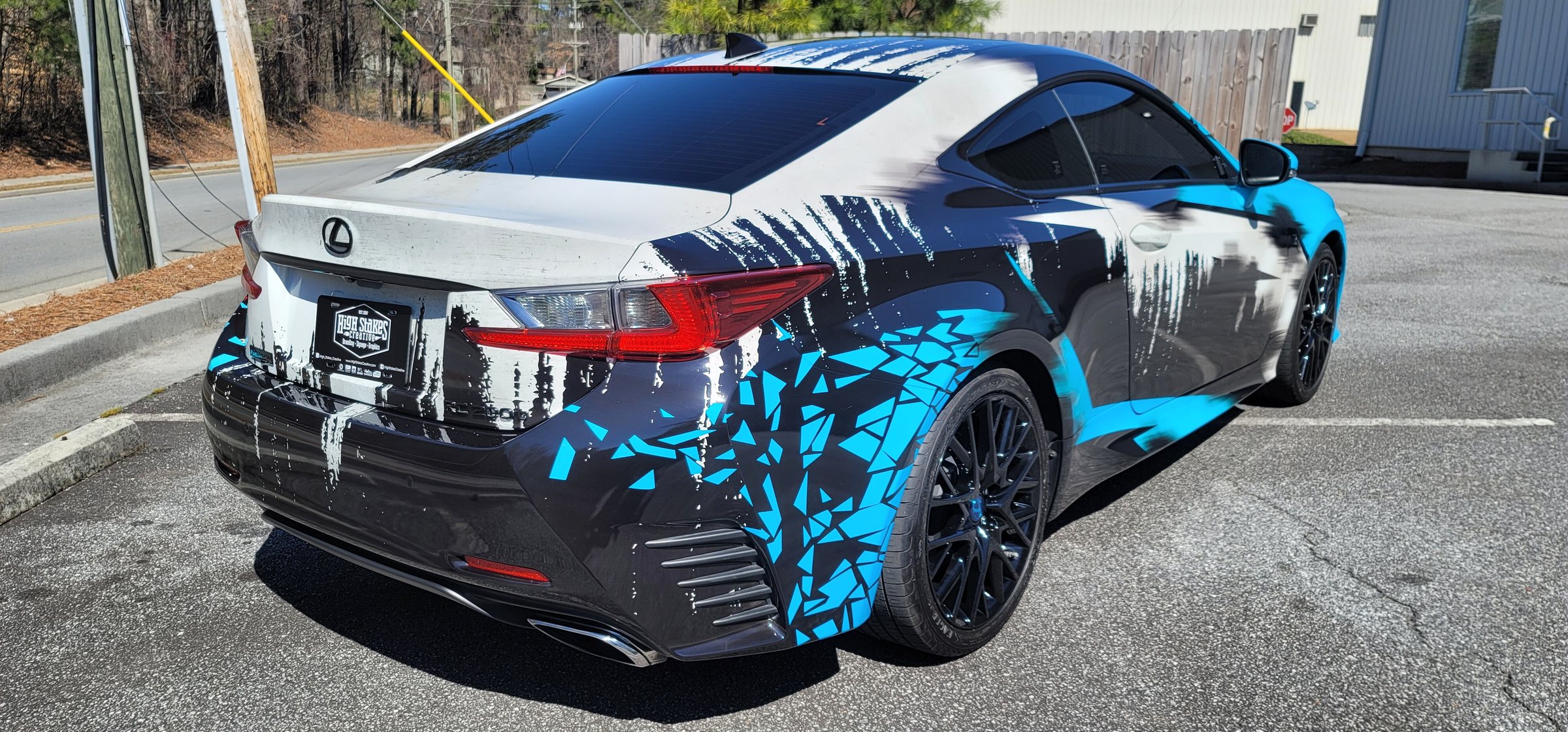 Custom paint-drip wrap, rear three-quarter view, by High Stakes Creative