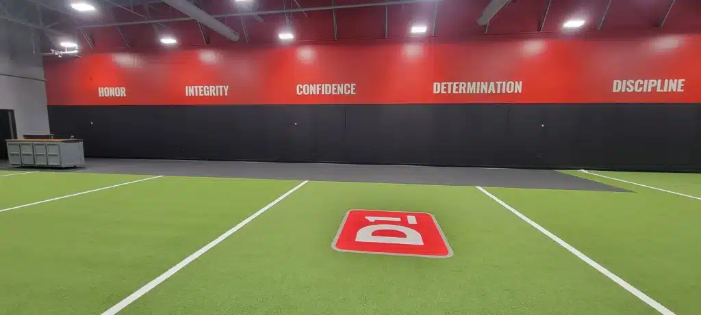 Turf gym core values wall, D1 Training, by High Stakes Creative