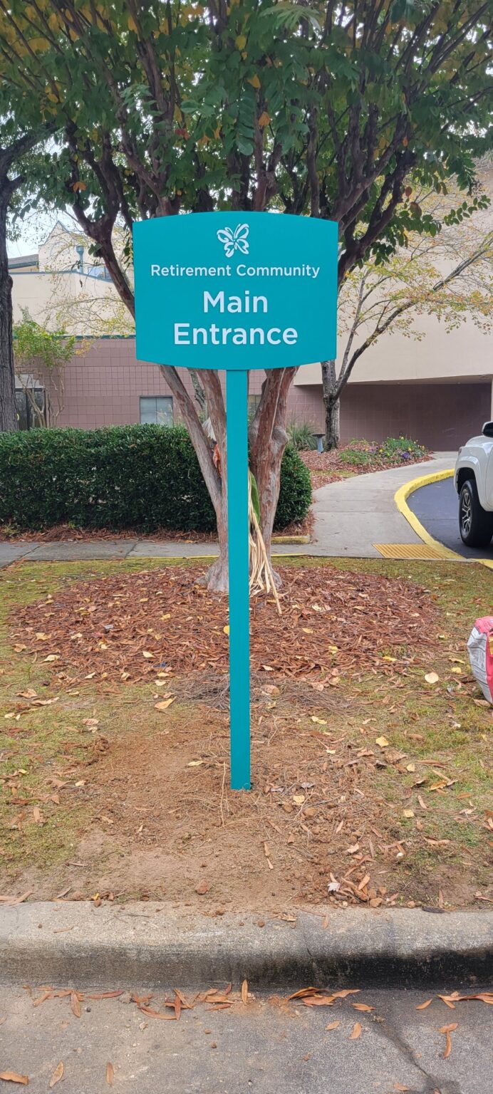 Main entrance post-and-panel wayfinding sign, Delmar Gardens, Gwinnett County, GA, by High Stakes Creative