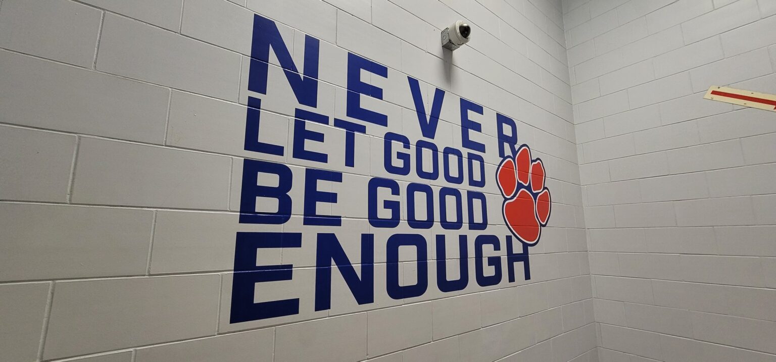'Never Let Good Be Good Enough' stairwell wall graphic, Dunwoody High School, Dunwoody, GA, by High Stakes Creative